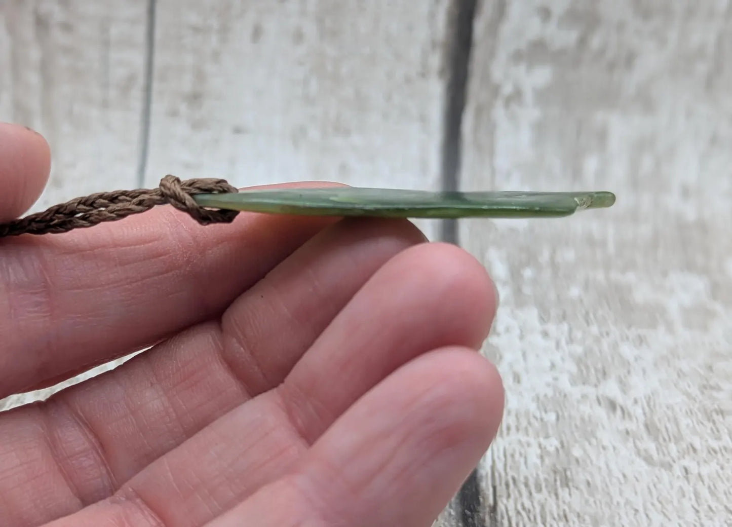 Tumble polished New Zealand pounamu greenstone jade pendant