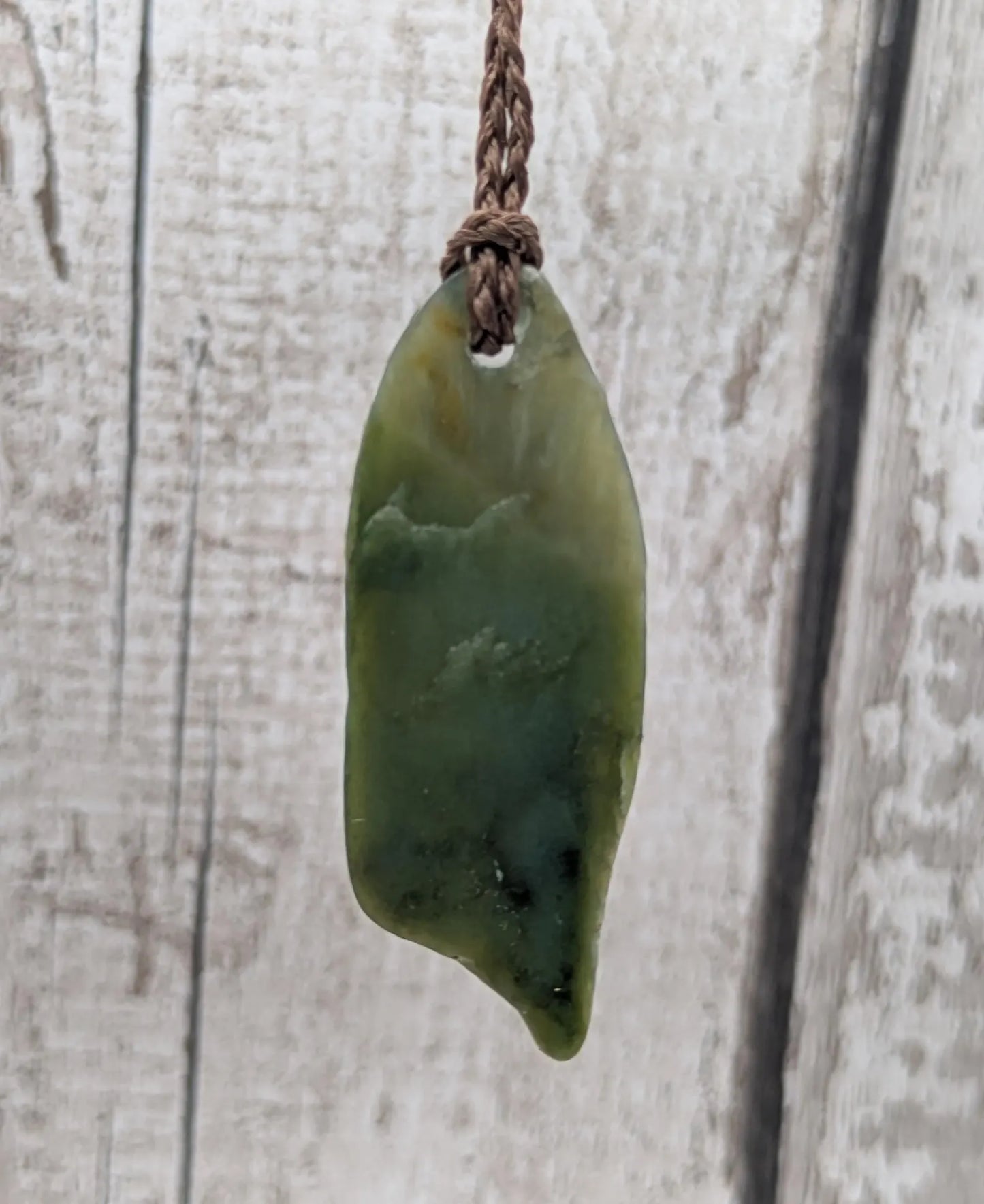 Tumble polished New Zealand pounamu greenstone jade pendant
