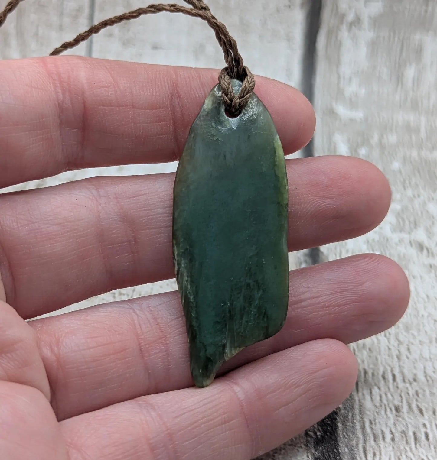 Tumble polished New Zealand pounamu greenstone jade pendant