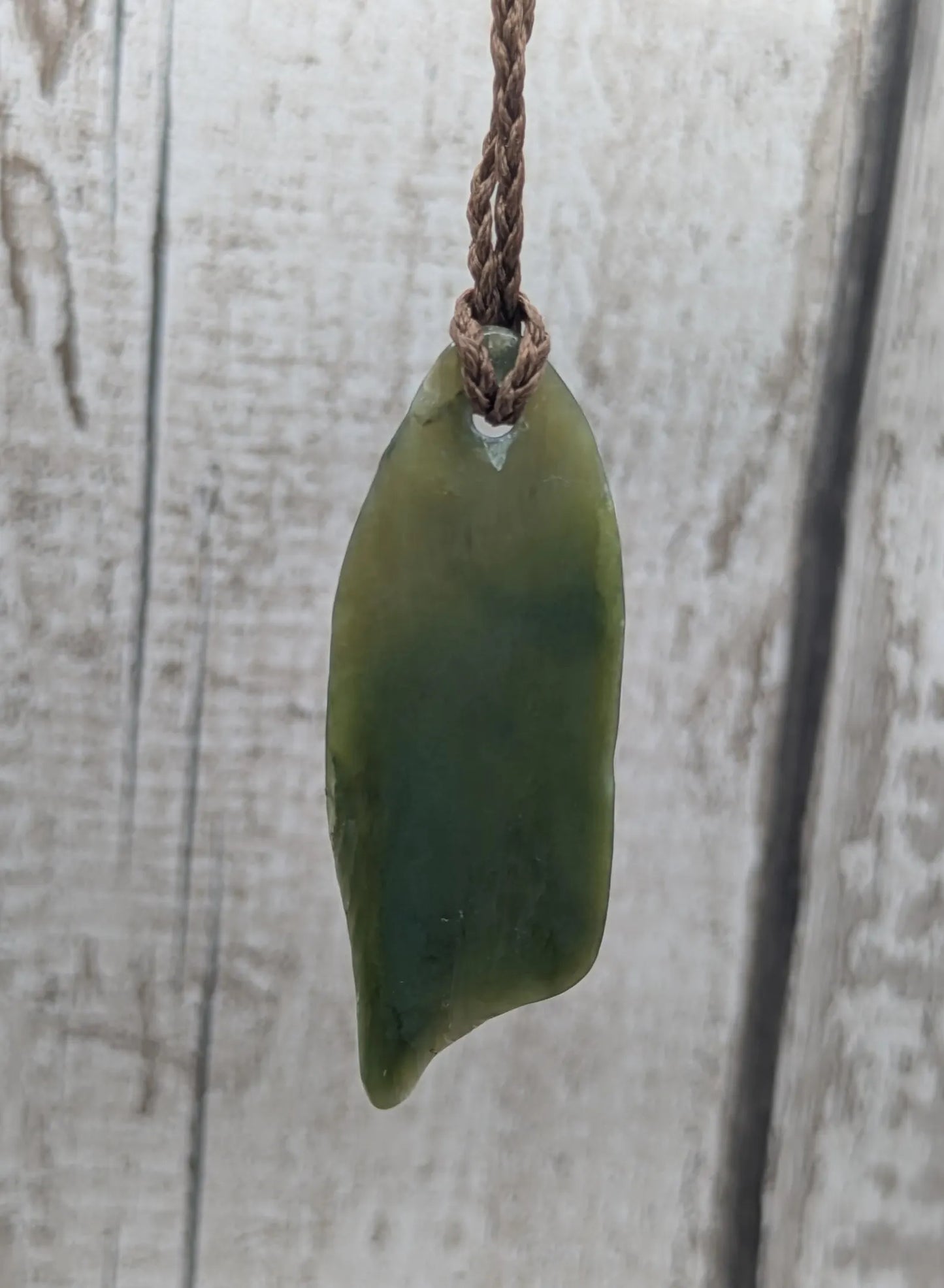 Tumble polished New Zealand pounamu greenstone jade pendant