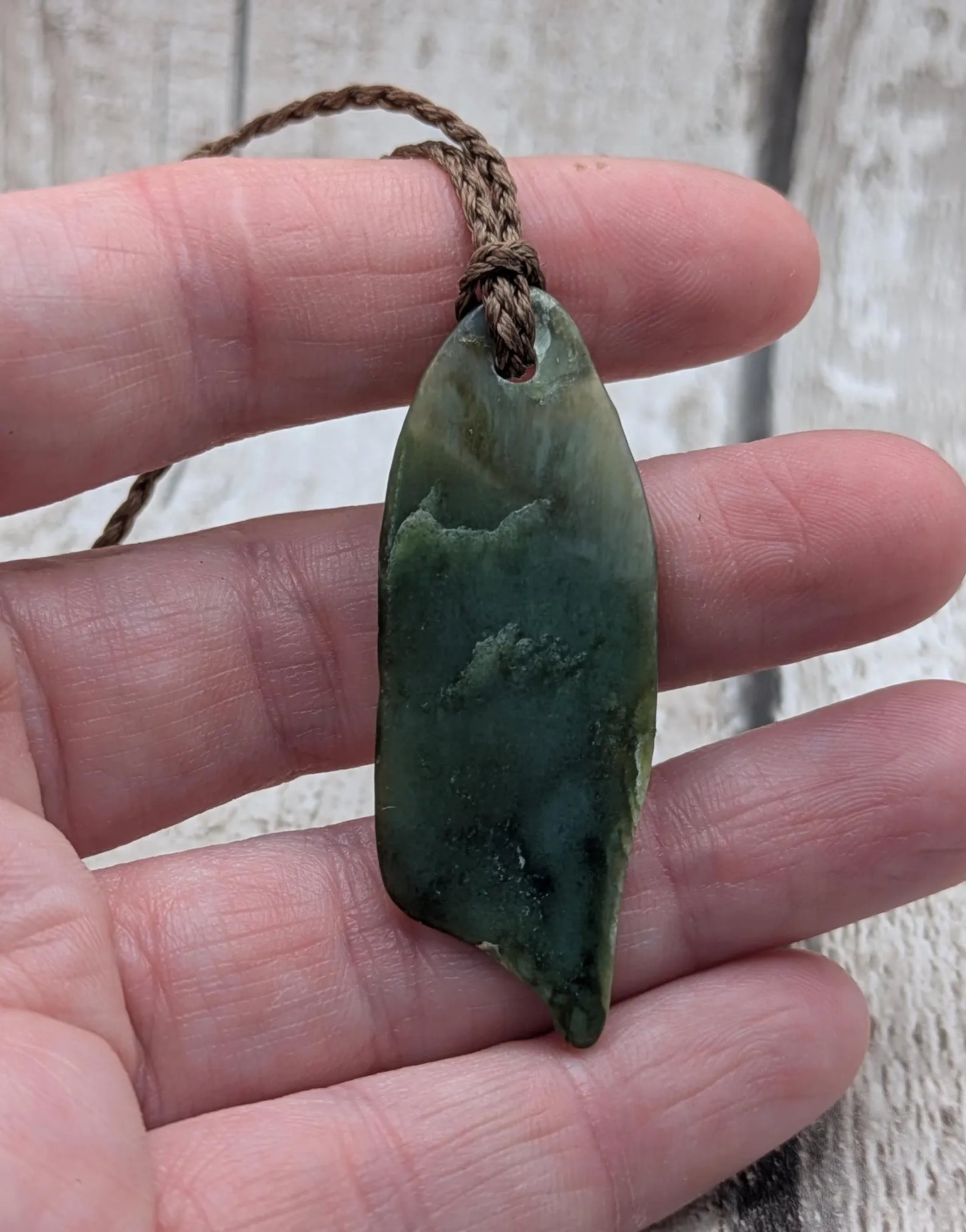 Tumble polished New Zealand pounamu greenstone jade pendant