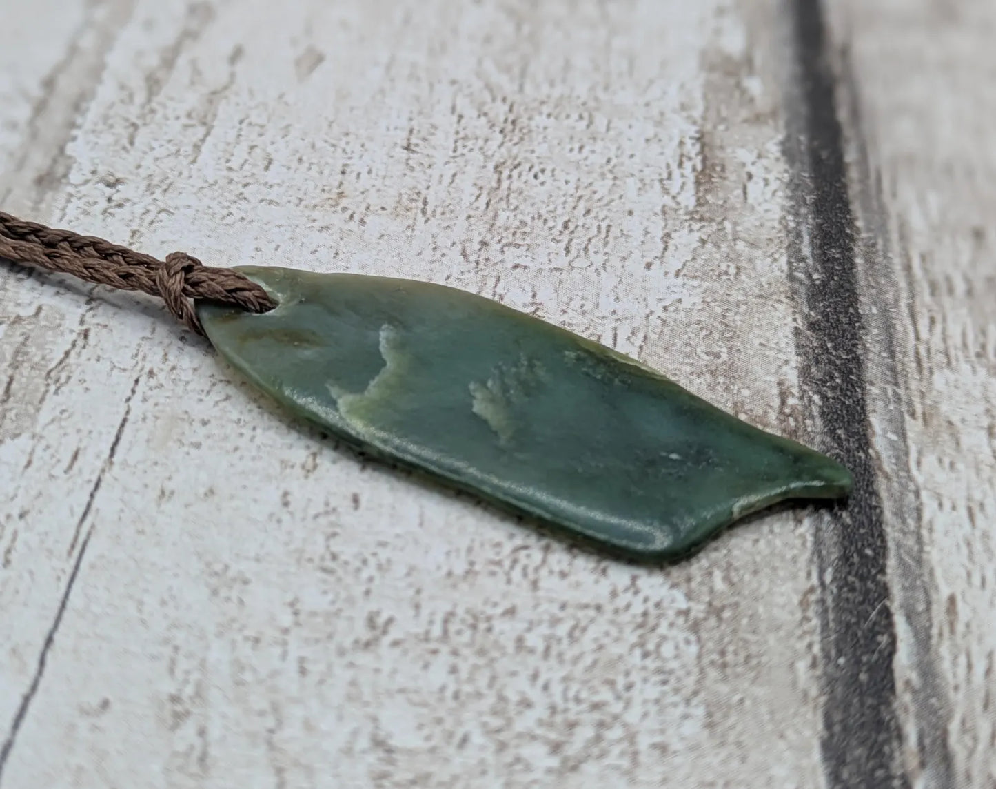 Tumble polished New Zealand pounamu greenstone jade pendant
