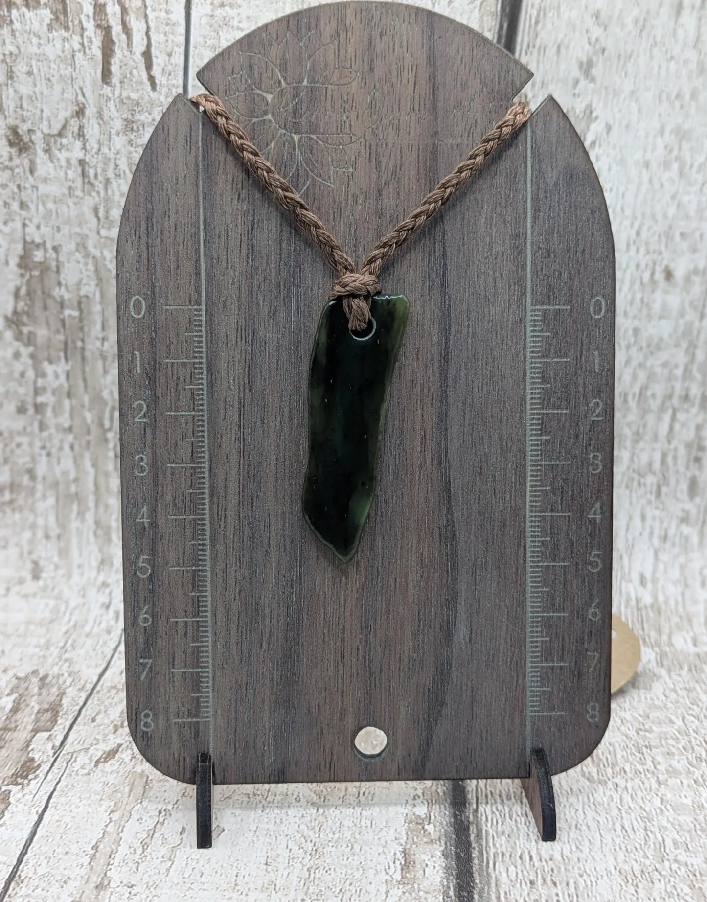 Tumble polished New Zealand pounamu greenstone jade pendant
