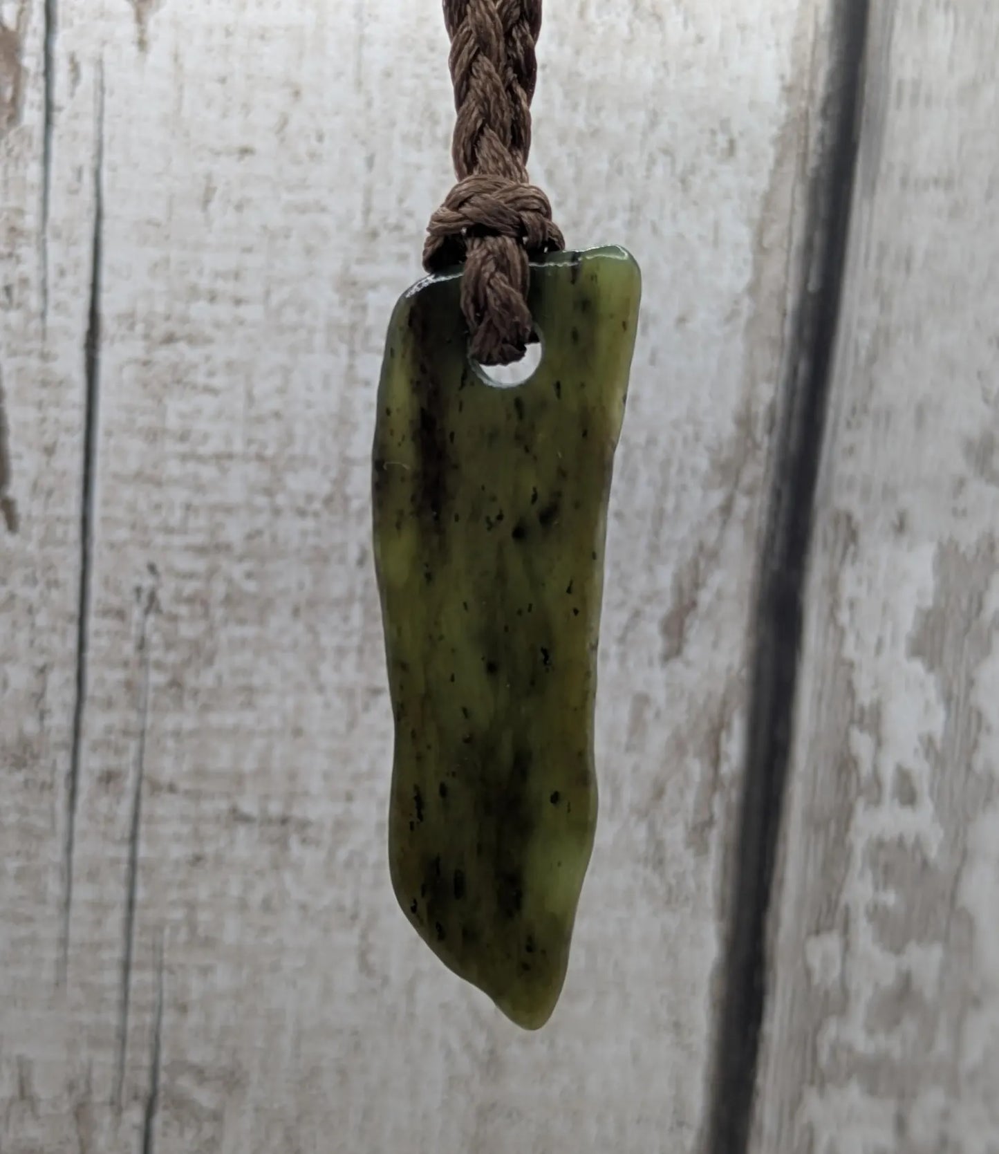 Tumble polished New Zealand pounamu greenstone jade pendant