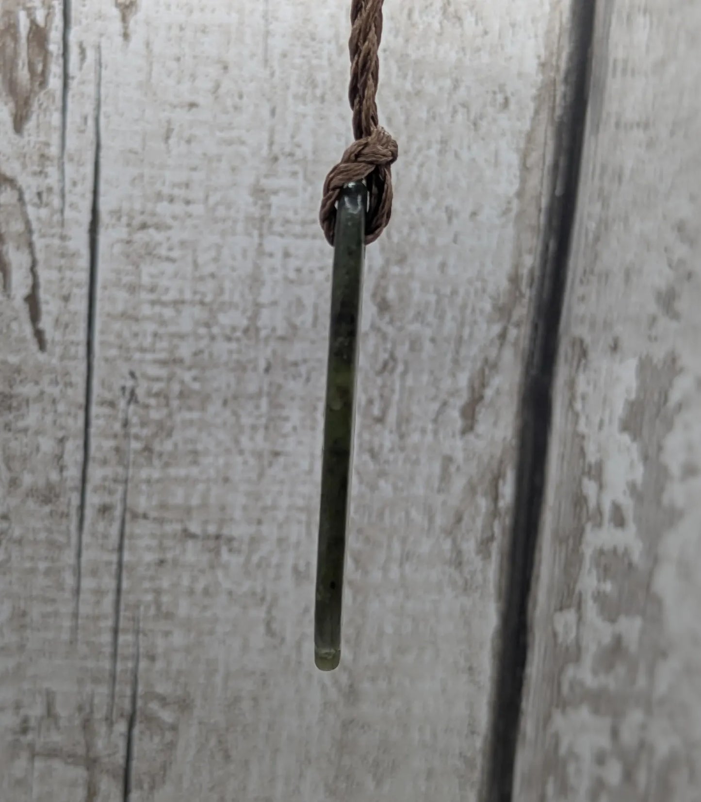 Tumble polished New Zealand pounamu greenstone jade pendant