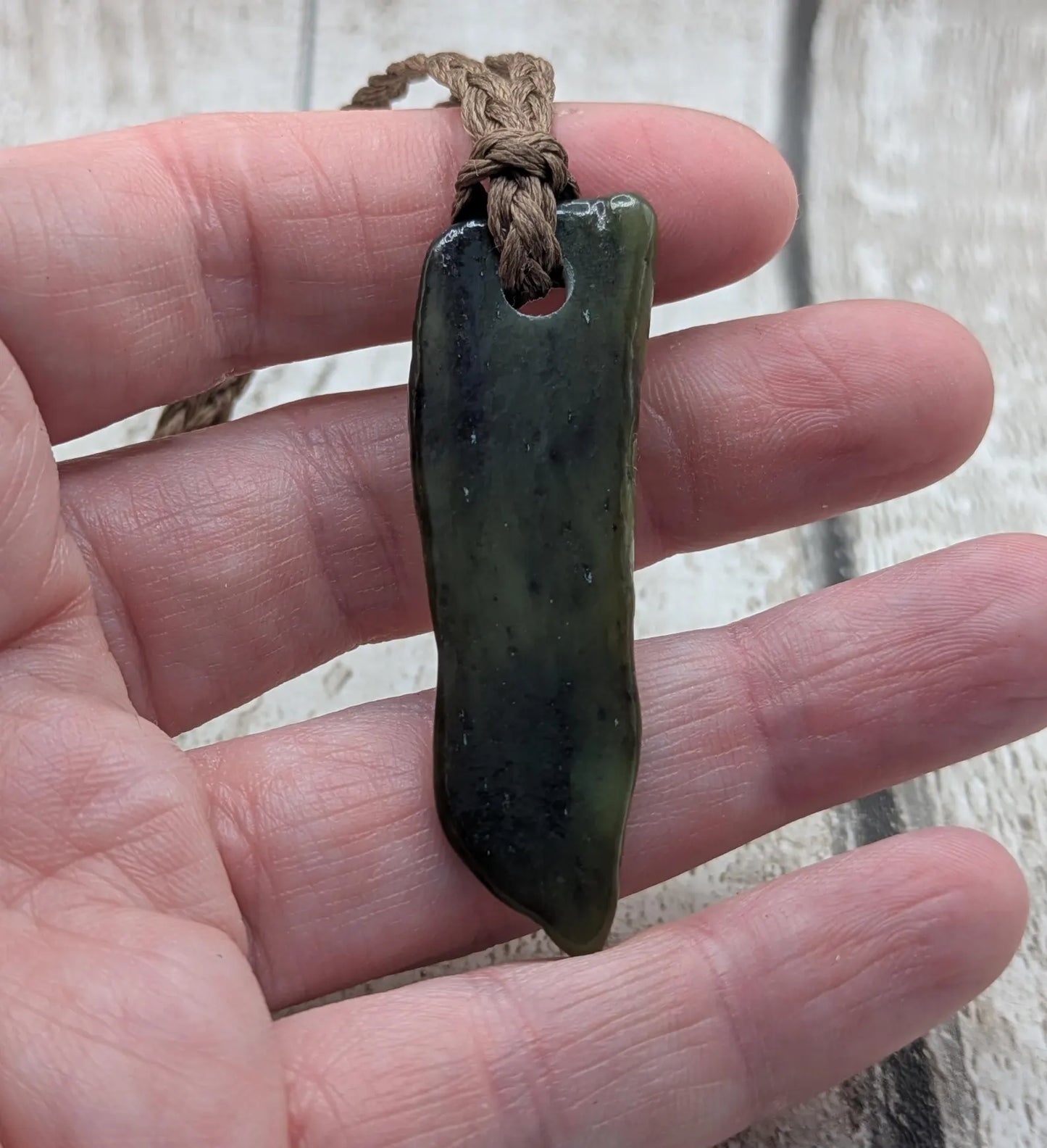 Tumble polished New Zealand pounamu greenstone jade pendant