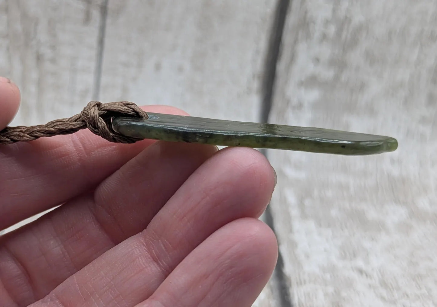 Tumble polished New Zealand pounamu greenstone jade pendant