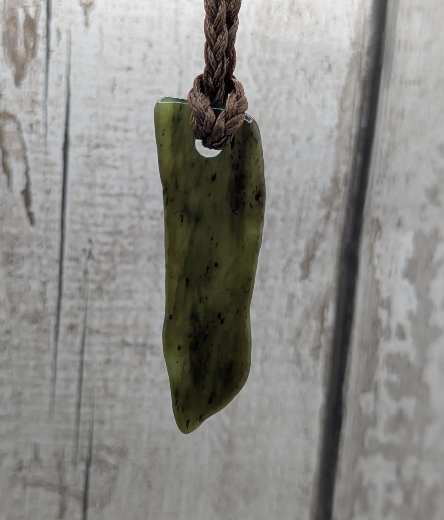 Tumble polished New Zealand pounamu greenstone jade pendant