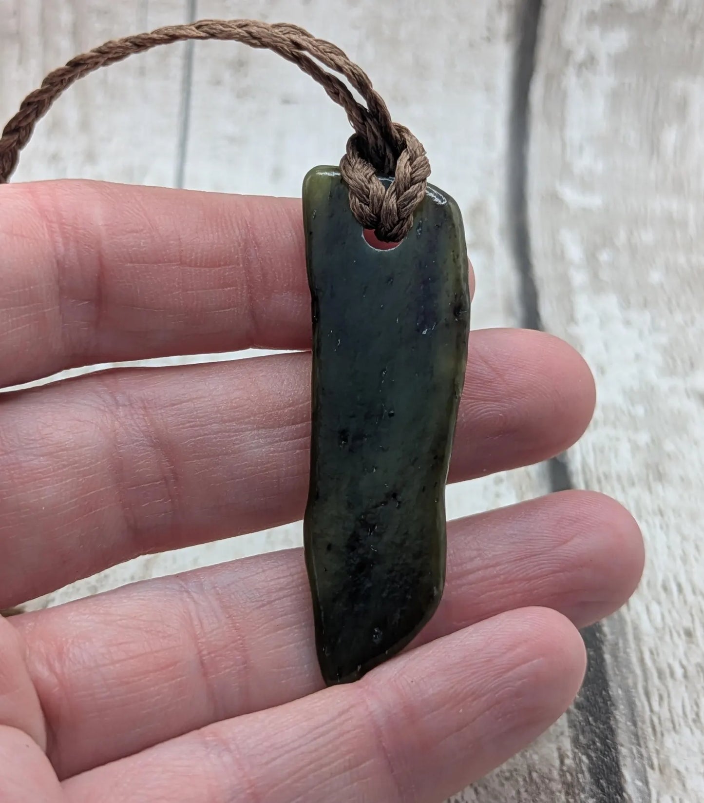 Tumble polished New Zealand pounamu greenstone jade pendant
