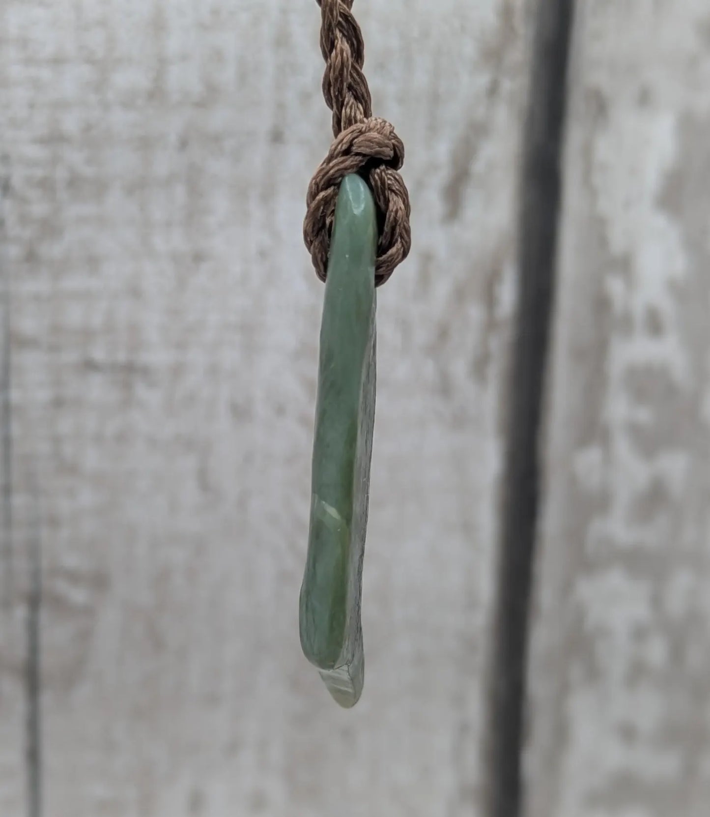 Tumble polished New Zealand pounamu greenstone jade pendant