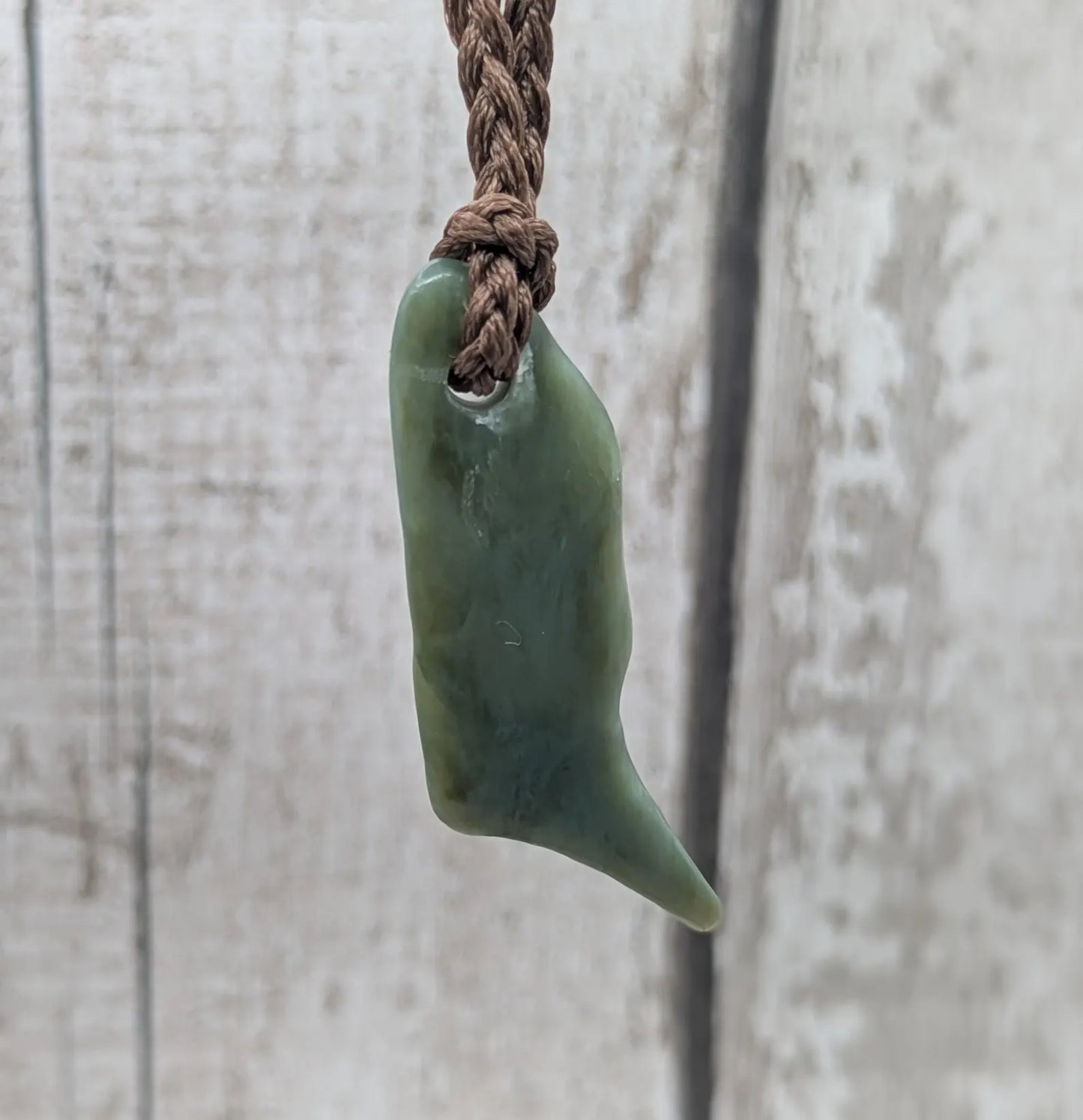 Tumble polished New Zealand pounamu greenstone jade pendant