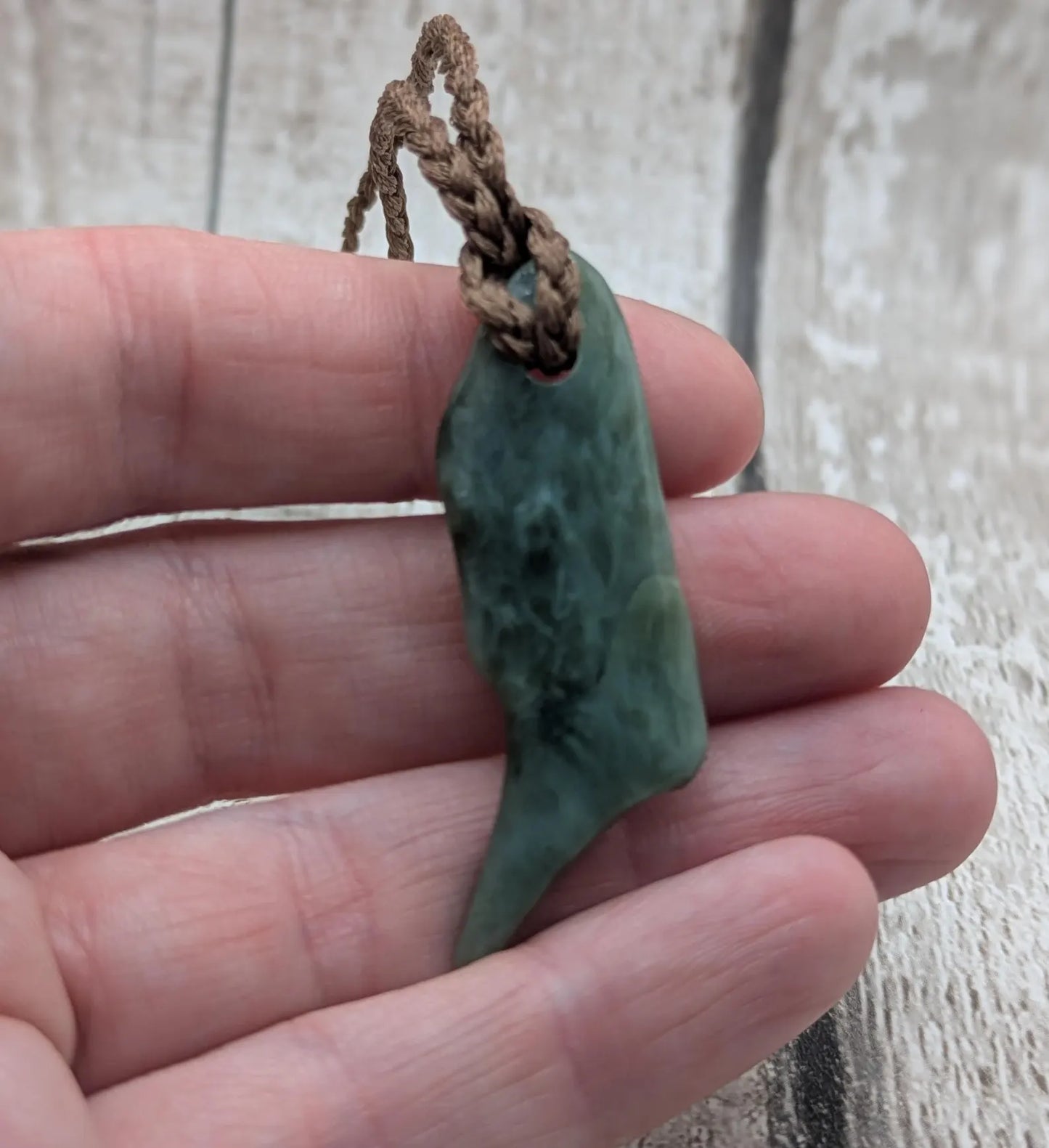 Tumble polished New Zealand pounamu greenstone jade pendant