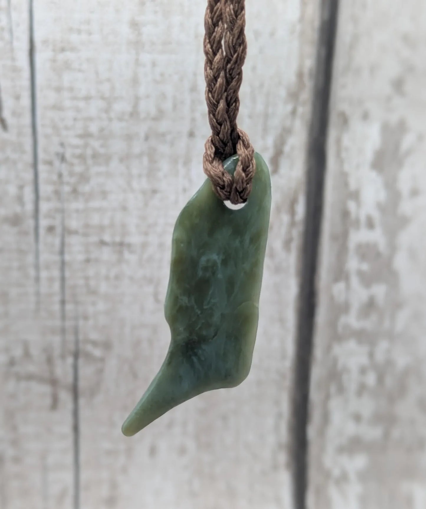 Tumble polished New Zealand pounamu greenstone jade pendant