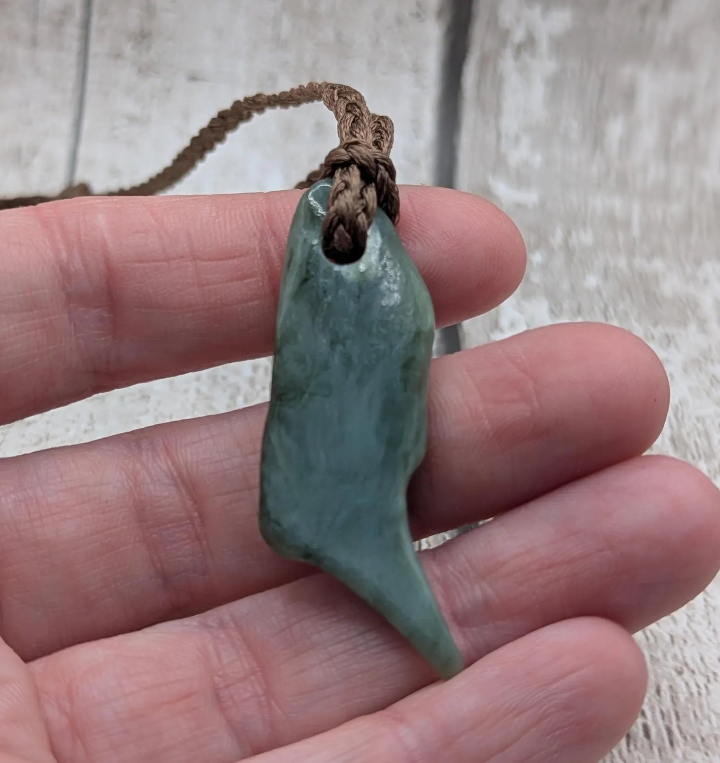 Tumble polished New Zealand pounamu greenstone jade pendant