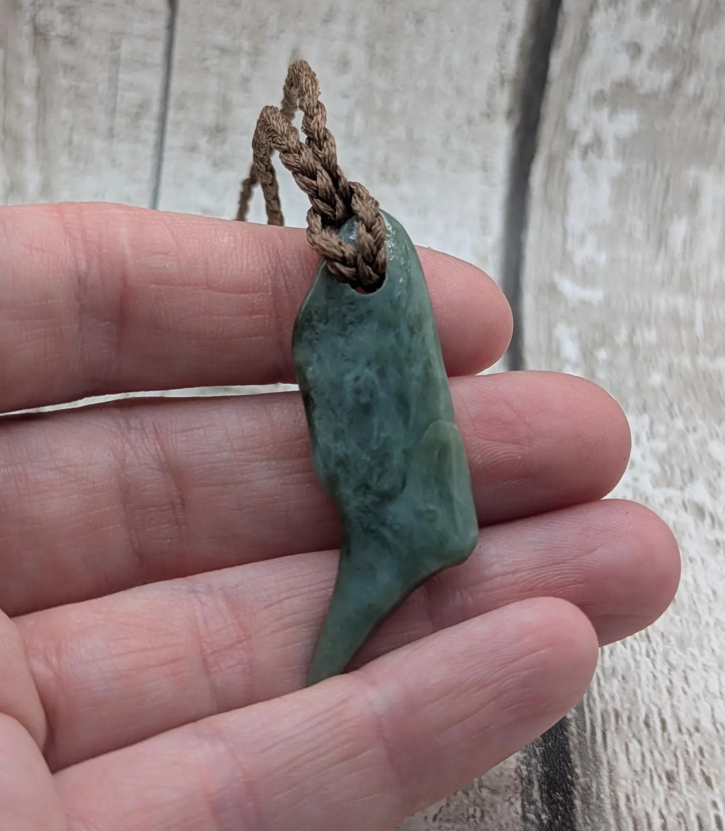 Tumble polished New Zealand pounamu greenstone jade pendant