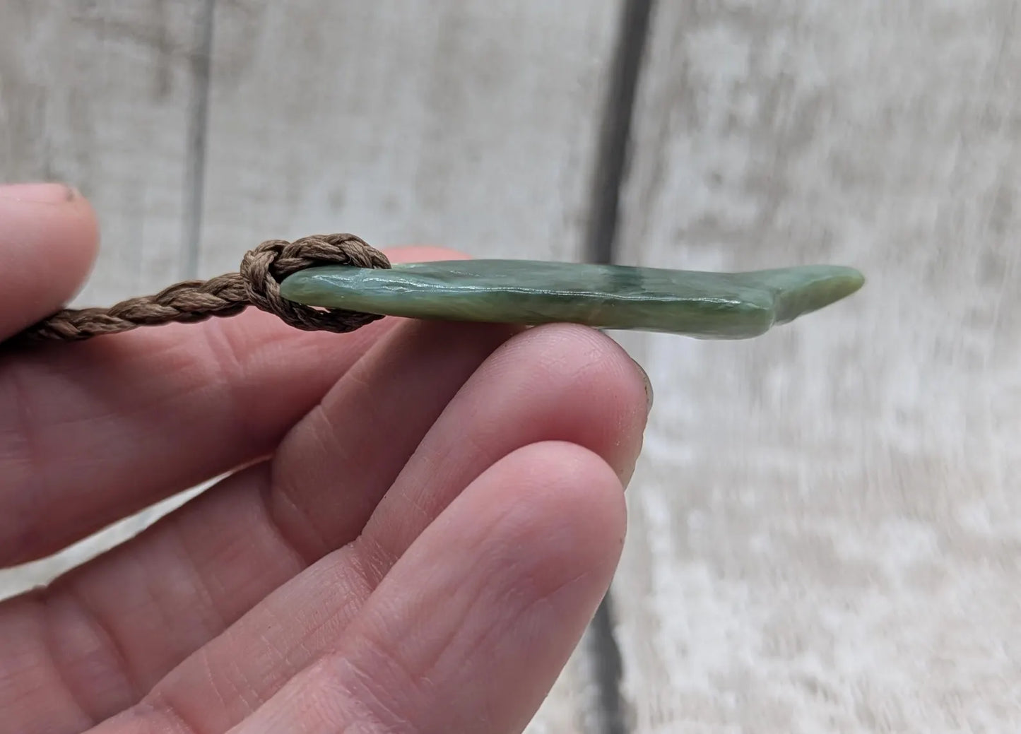 Tumble polished New Zealand pounamu greenstone jade pendant