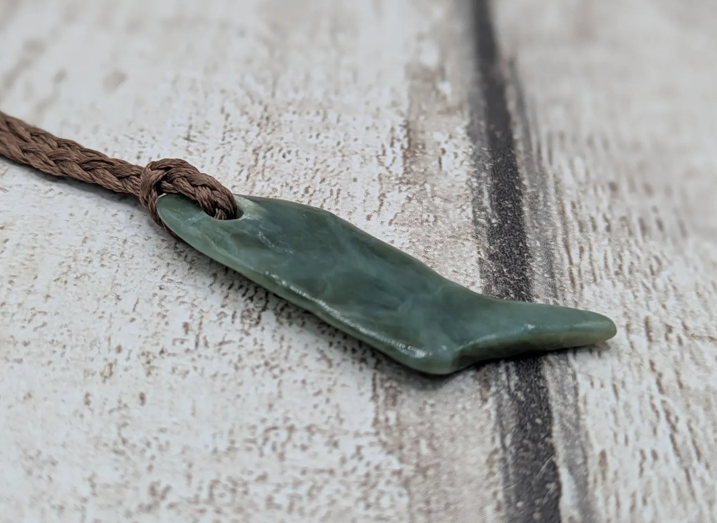 Tumble polished New Zealand pounamu greenstone jade pendant