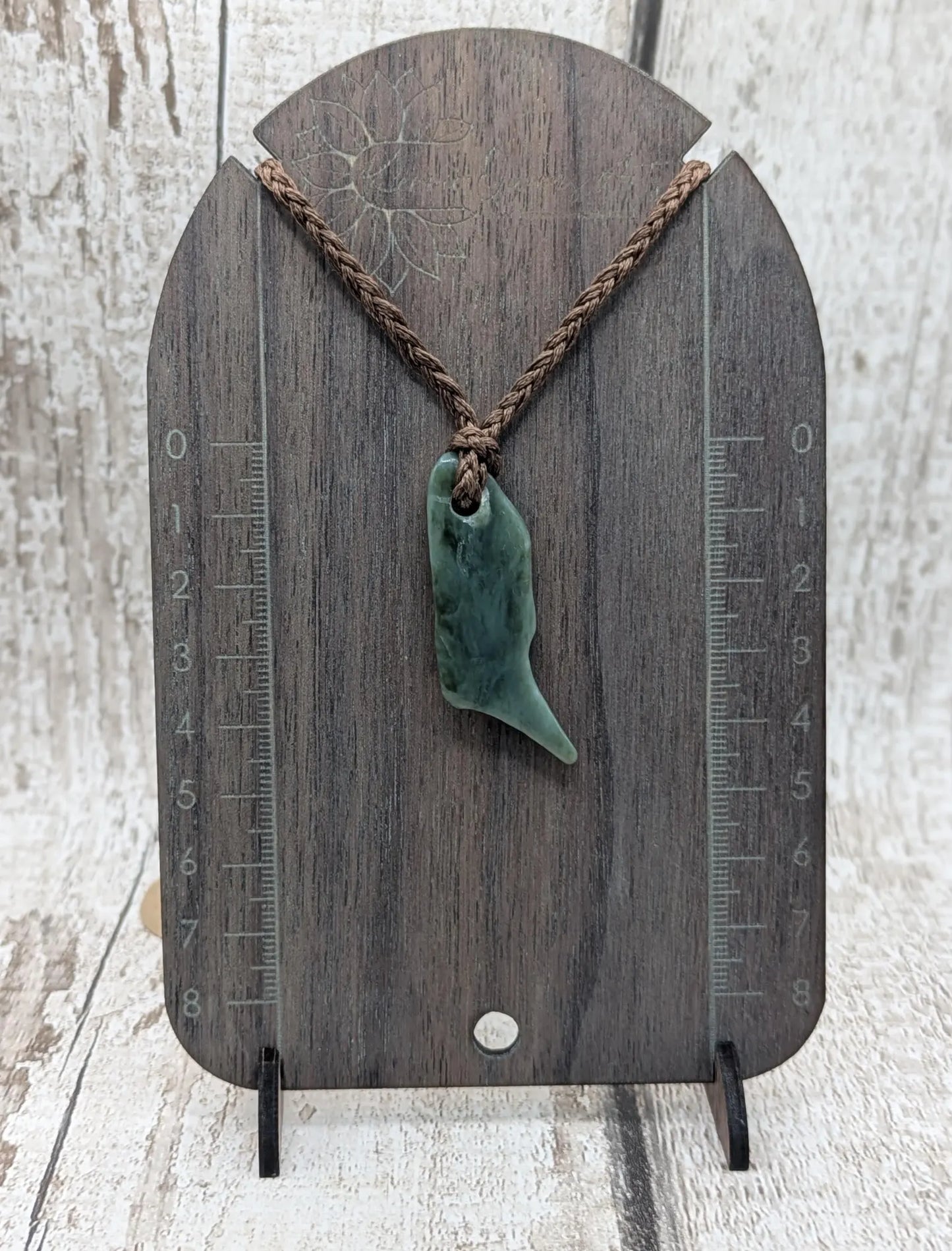 Tumble polished New Zealand pounamu greenstone jade pendant
