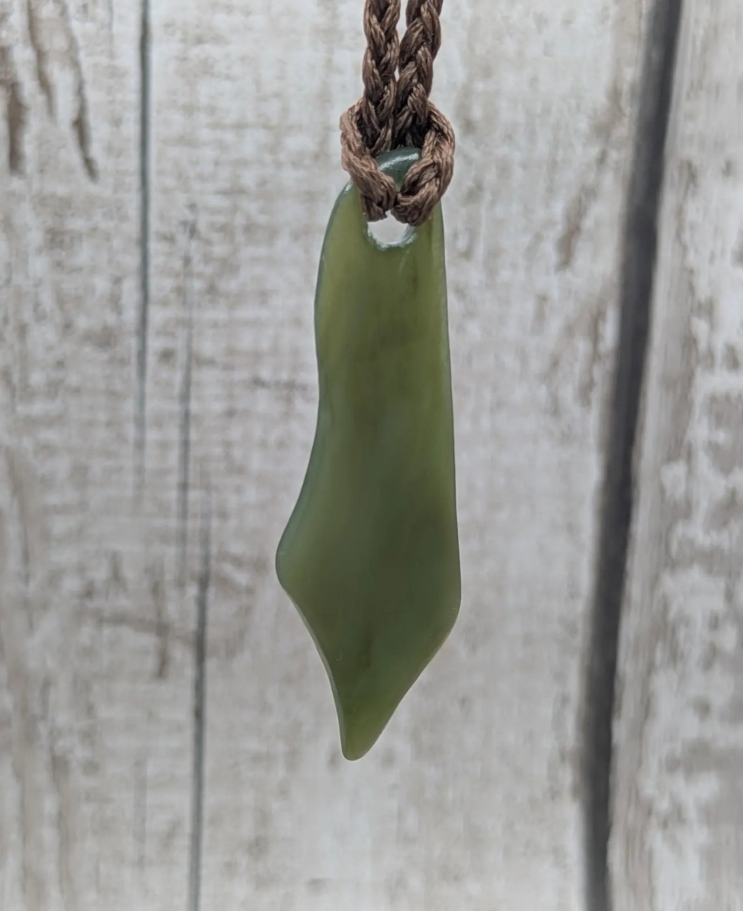 Large tumble Polished new Zealand pounamu greenstone jade pendant.