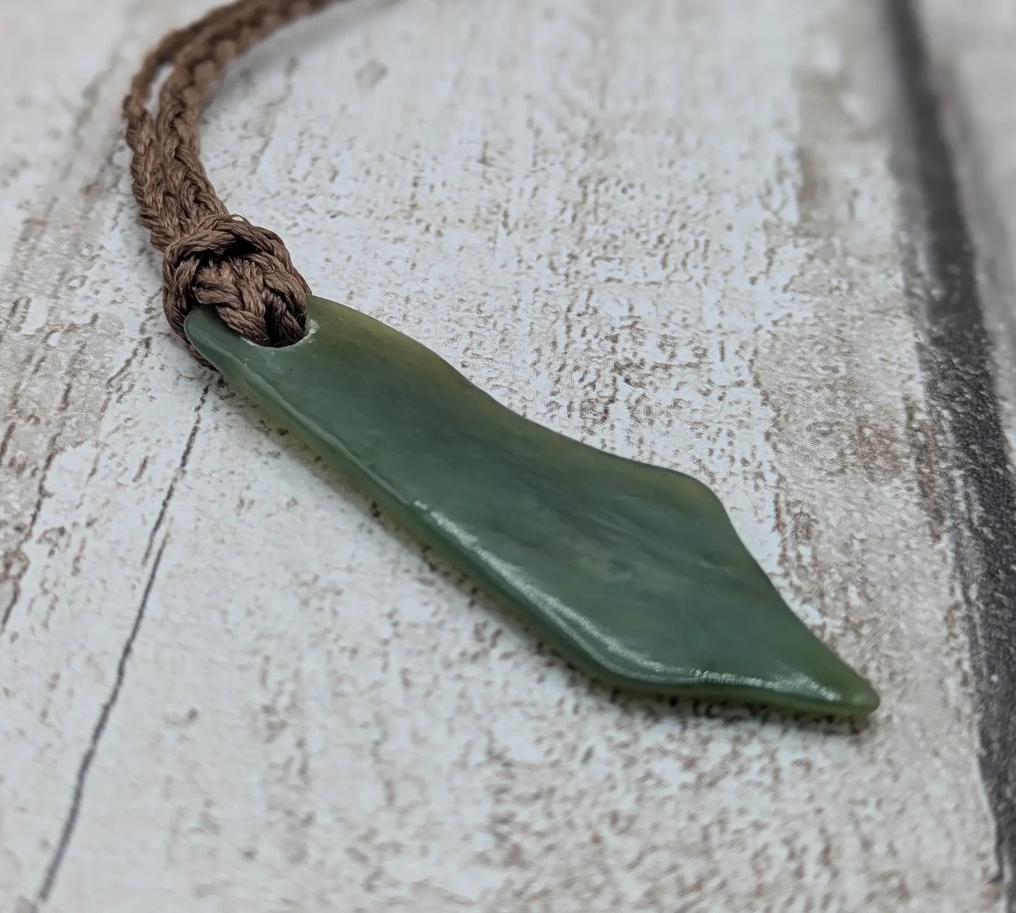 Large tumble Polished new Zealand pounamu greenstone jade pendant.