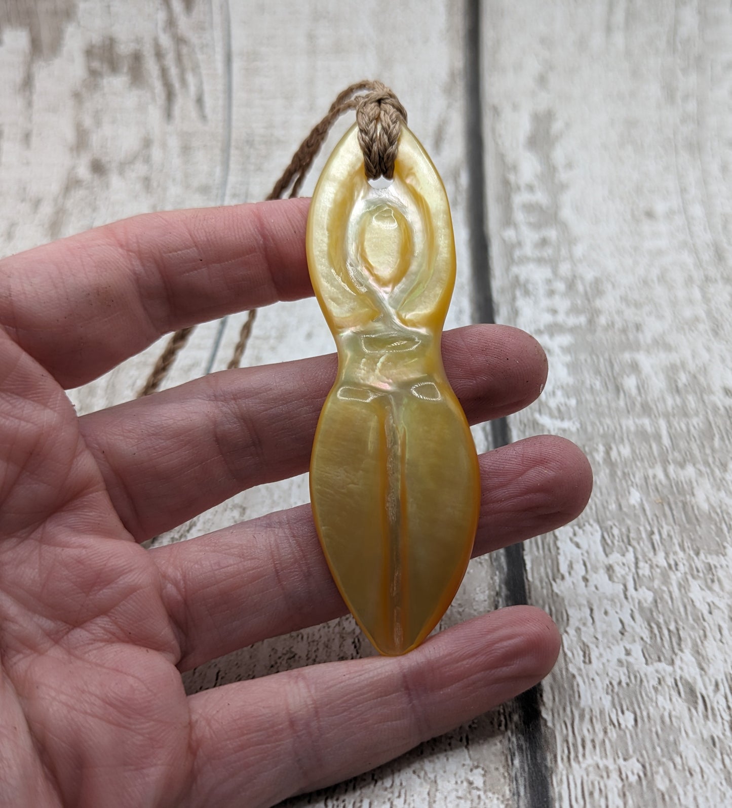 Mother of pearl shell goddess deity pendant.