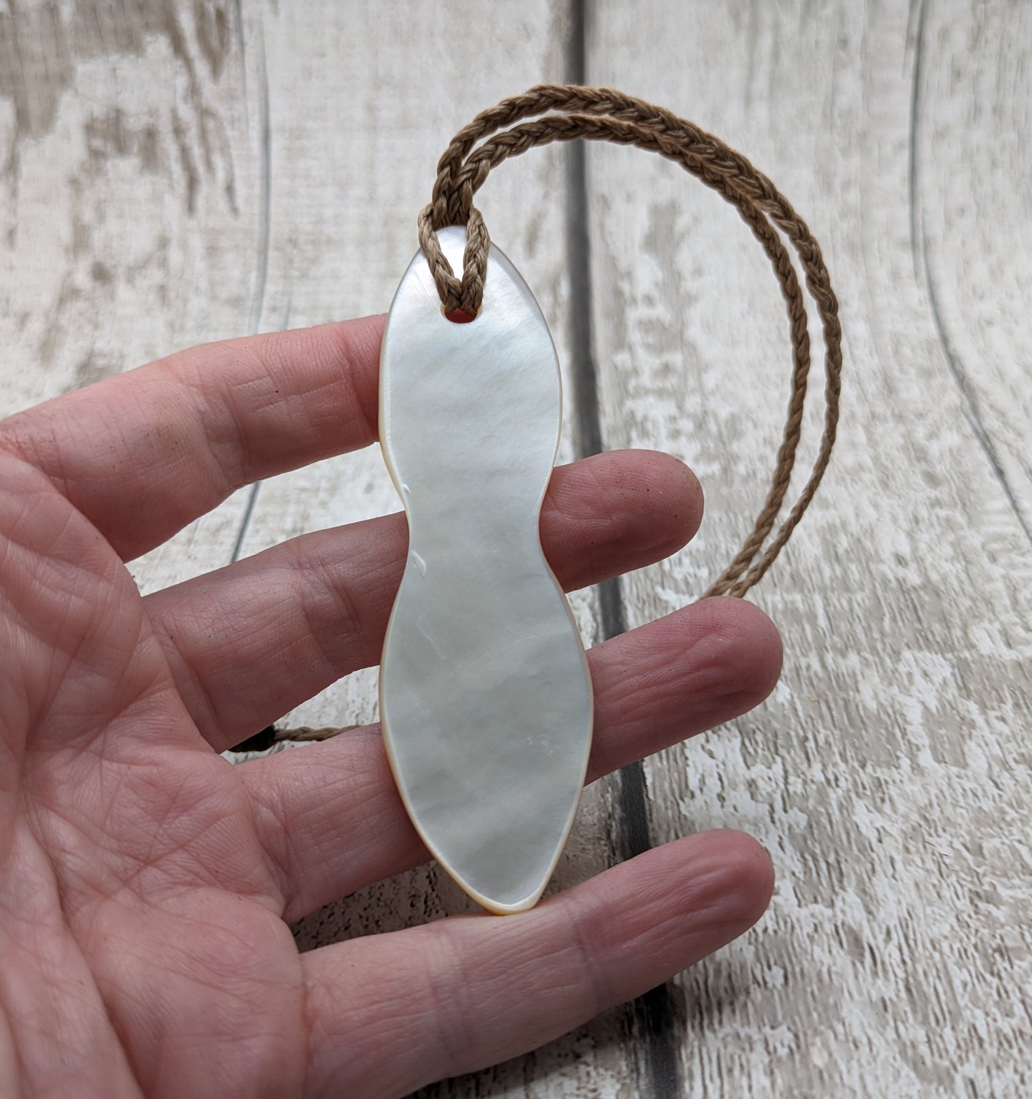 Mother of pearl shell goddess deity pendant.