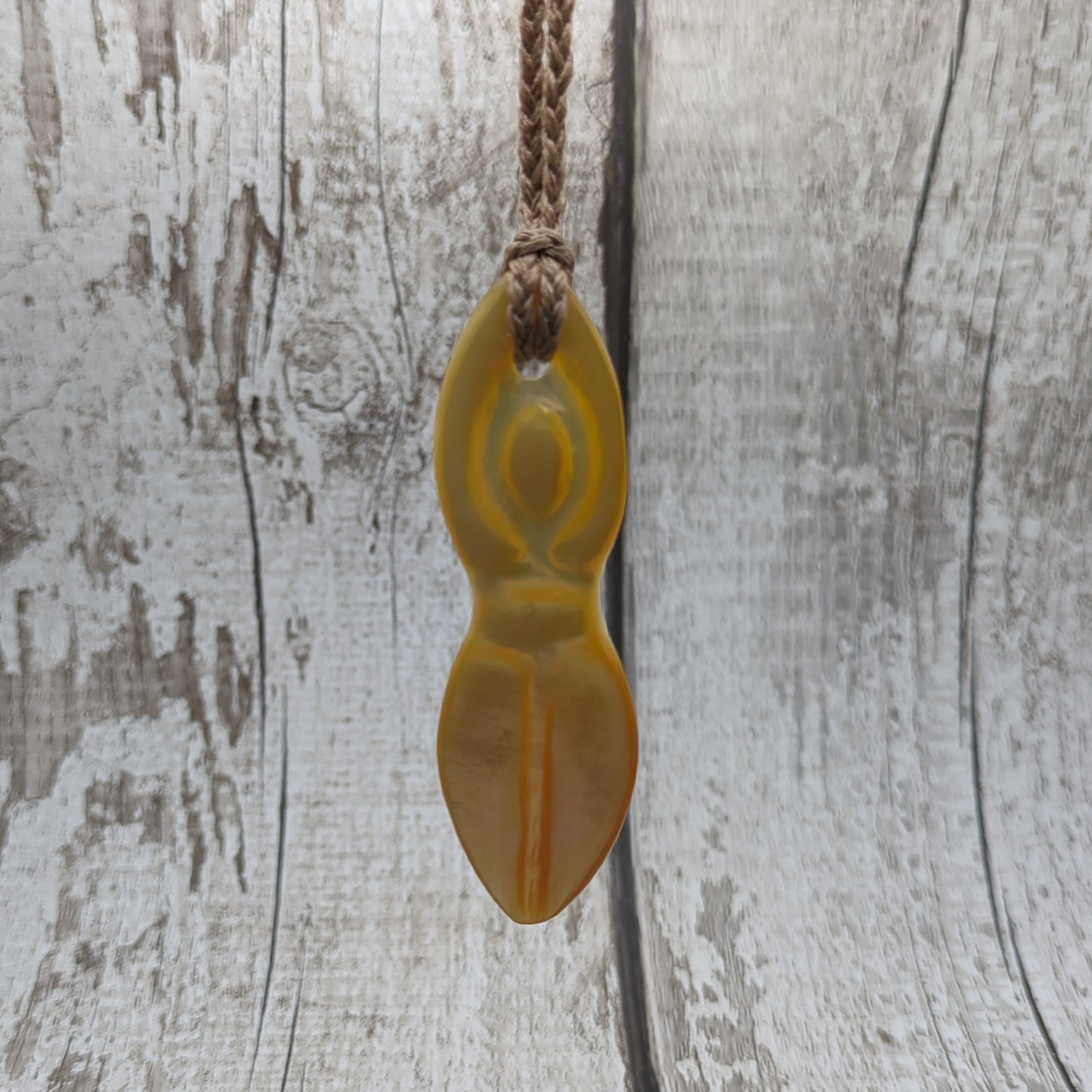 Mother of pearl shell goddess deity pendant.