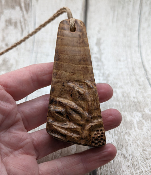 Birch wood sunflower toki styled pendant.