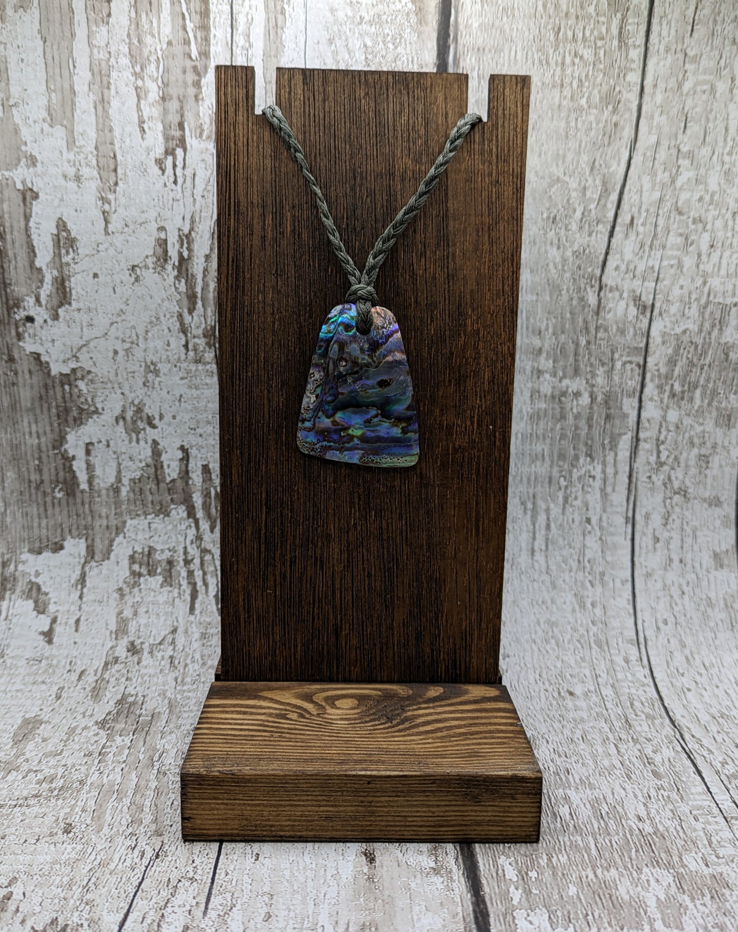 New Zealand rainbow pāua shell pendant.