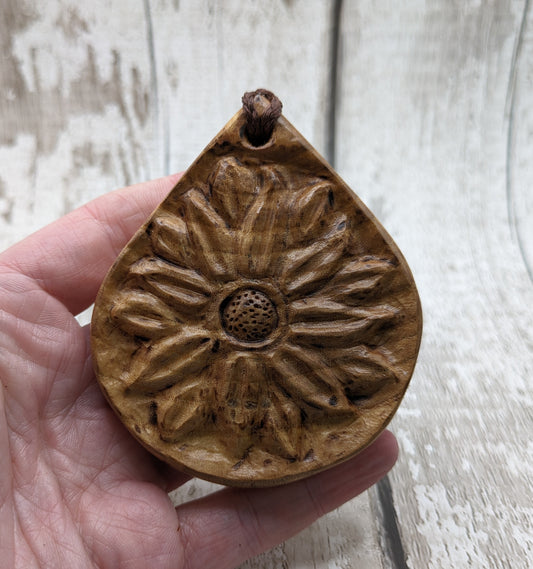 Birch wood sunflower medallion pendant.