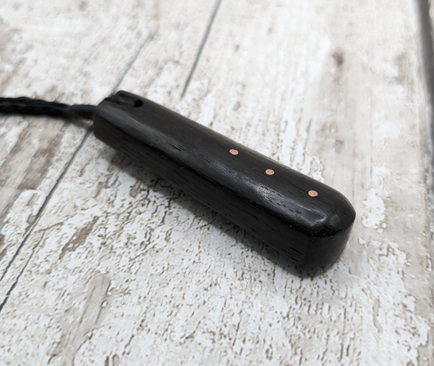 Fenland bog oak with copper pin inlay roimata pendant.