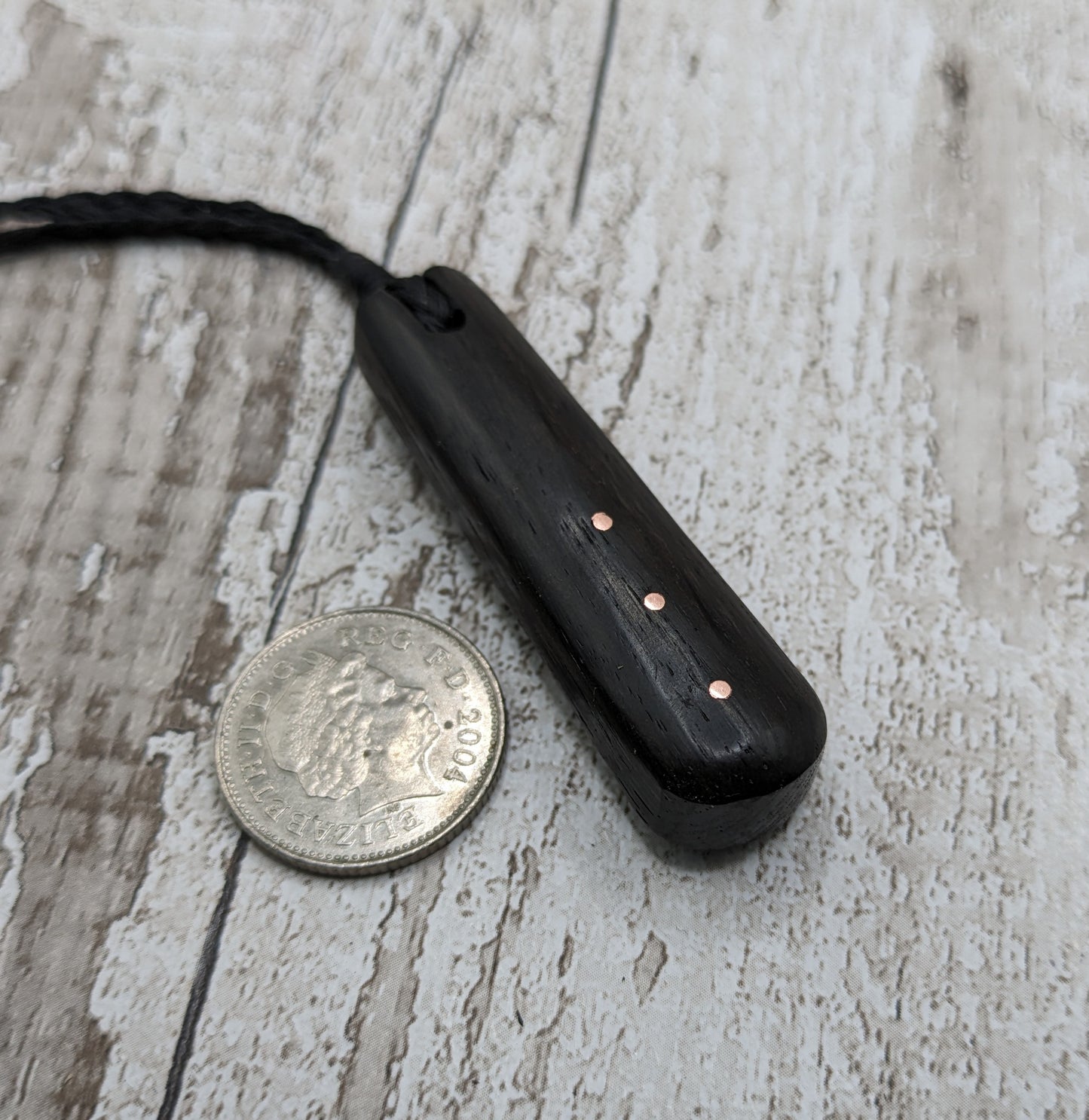 Fenland bog oak with copper pin inlay roimata pendant.