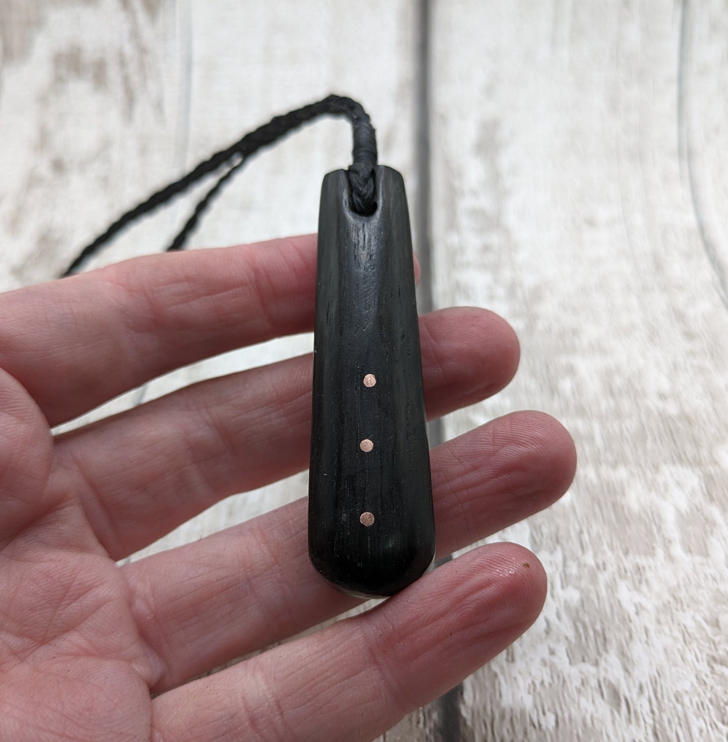 Fenland bog oak with copper pin inlay roimata pendant.