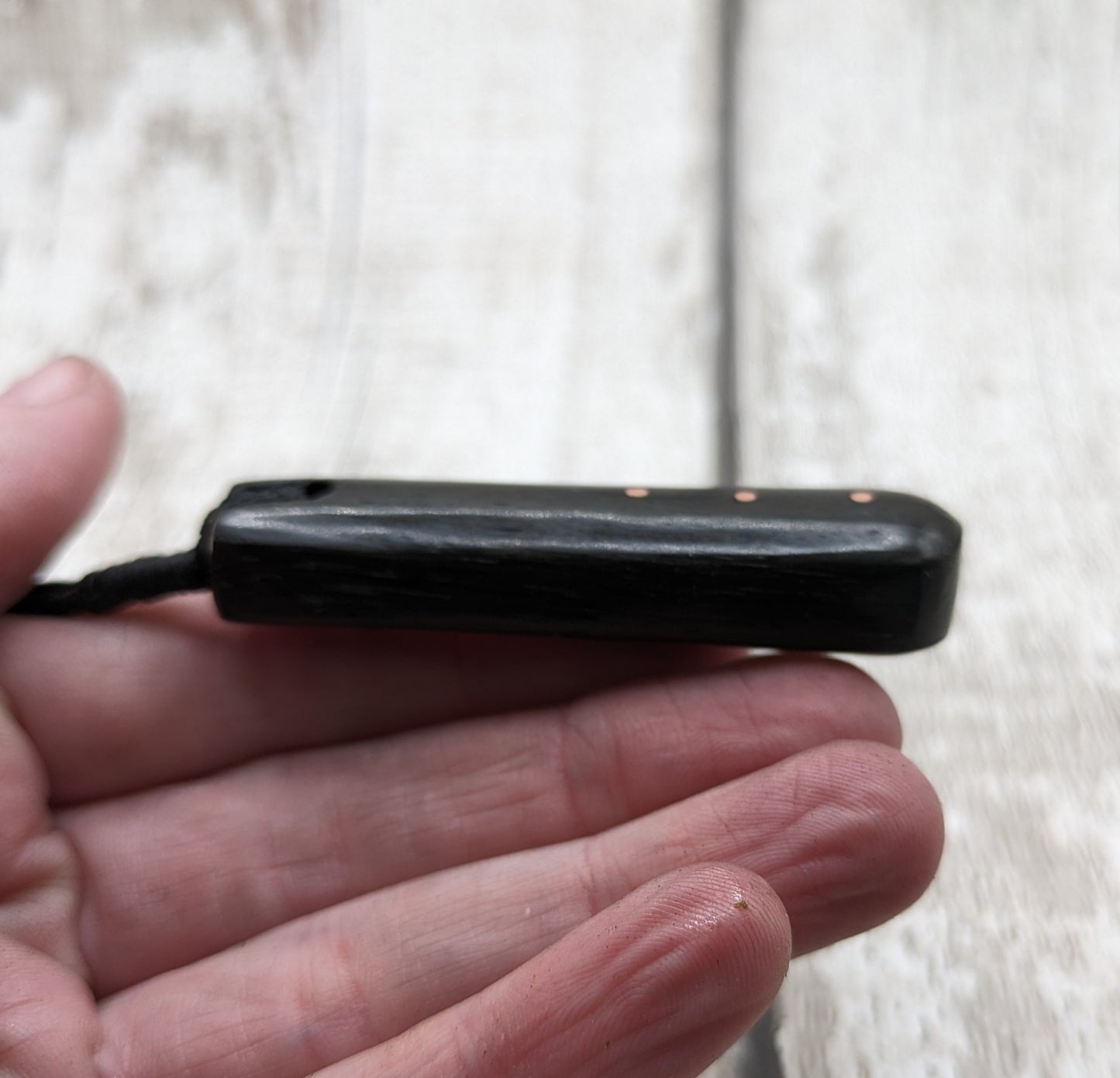 Fenland bog oak with copper pin inlay roimata pendant.