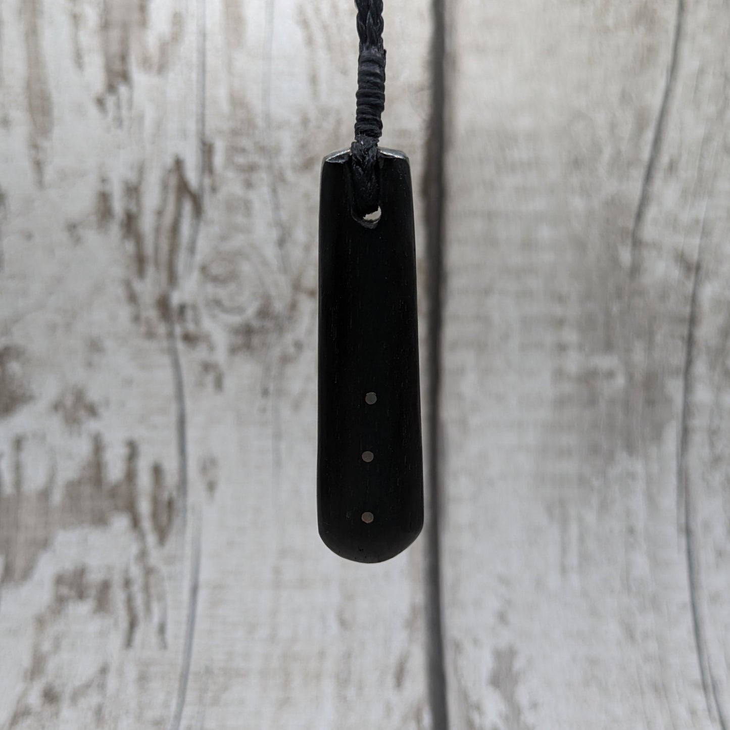 Fenland bog oak with copper pin inlay roimata pendant.