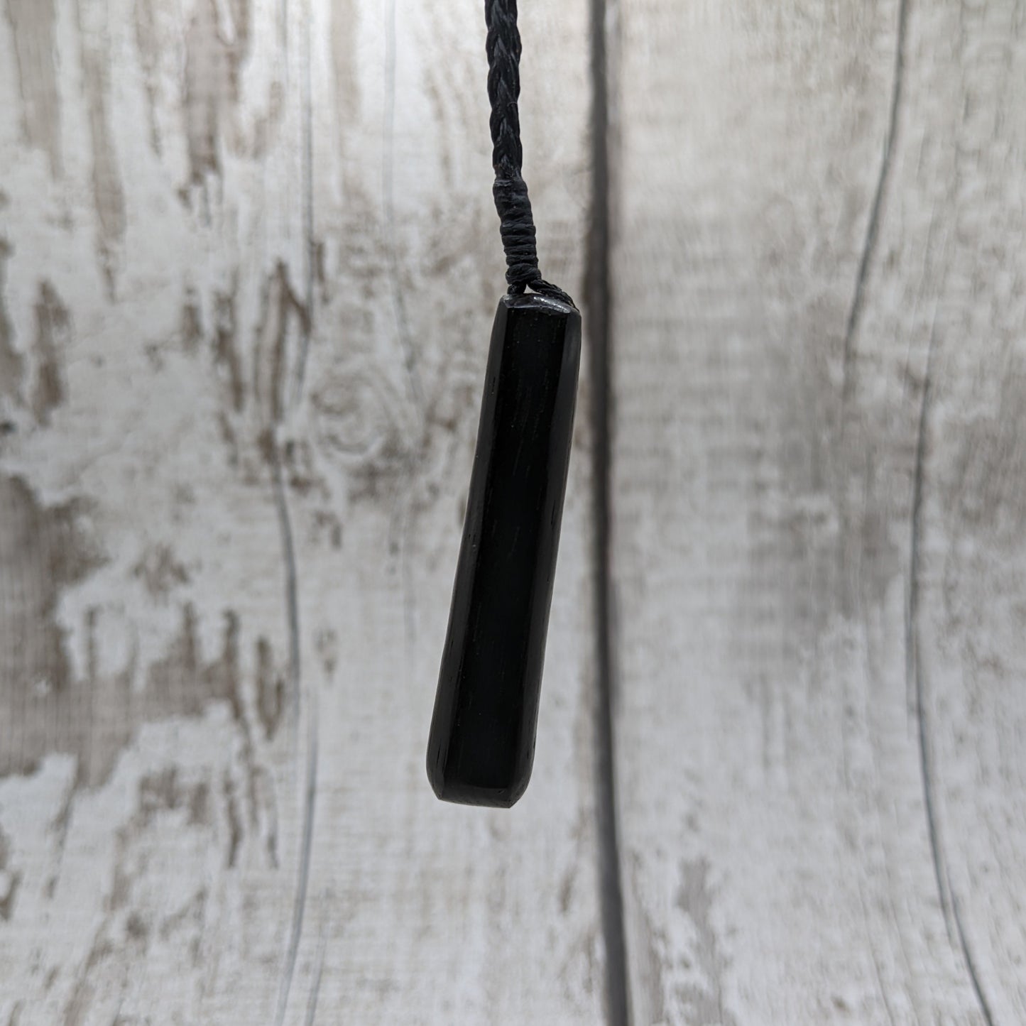 Fenland bog oak with copper pin inlay roimata pendant.