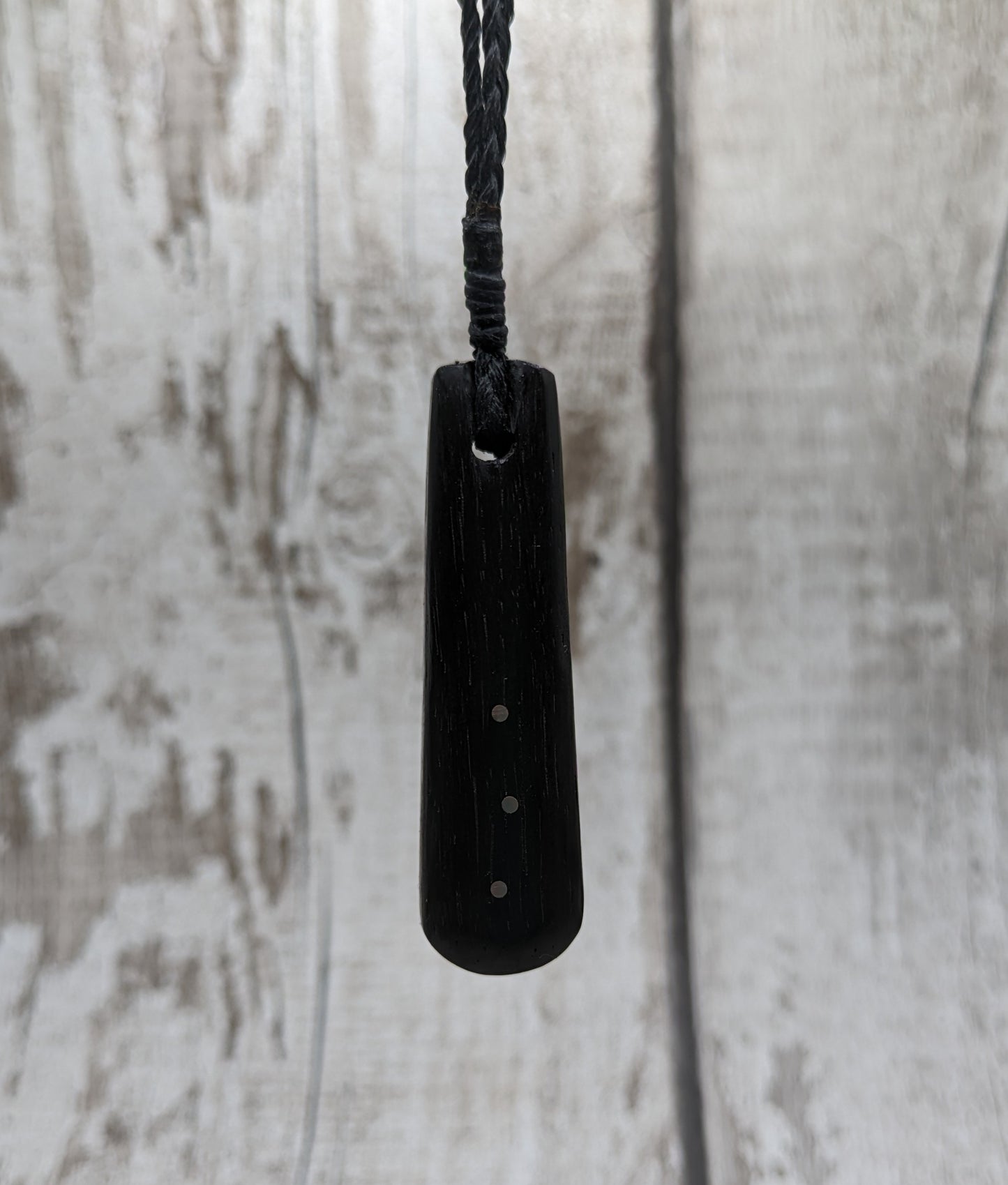 Fenland bog oak with copper pin inlay roimata pendant.