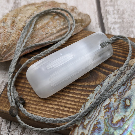 Selenite satin spar toki style pendant.