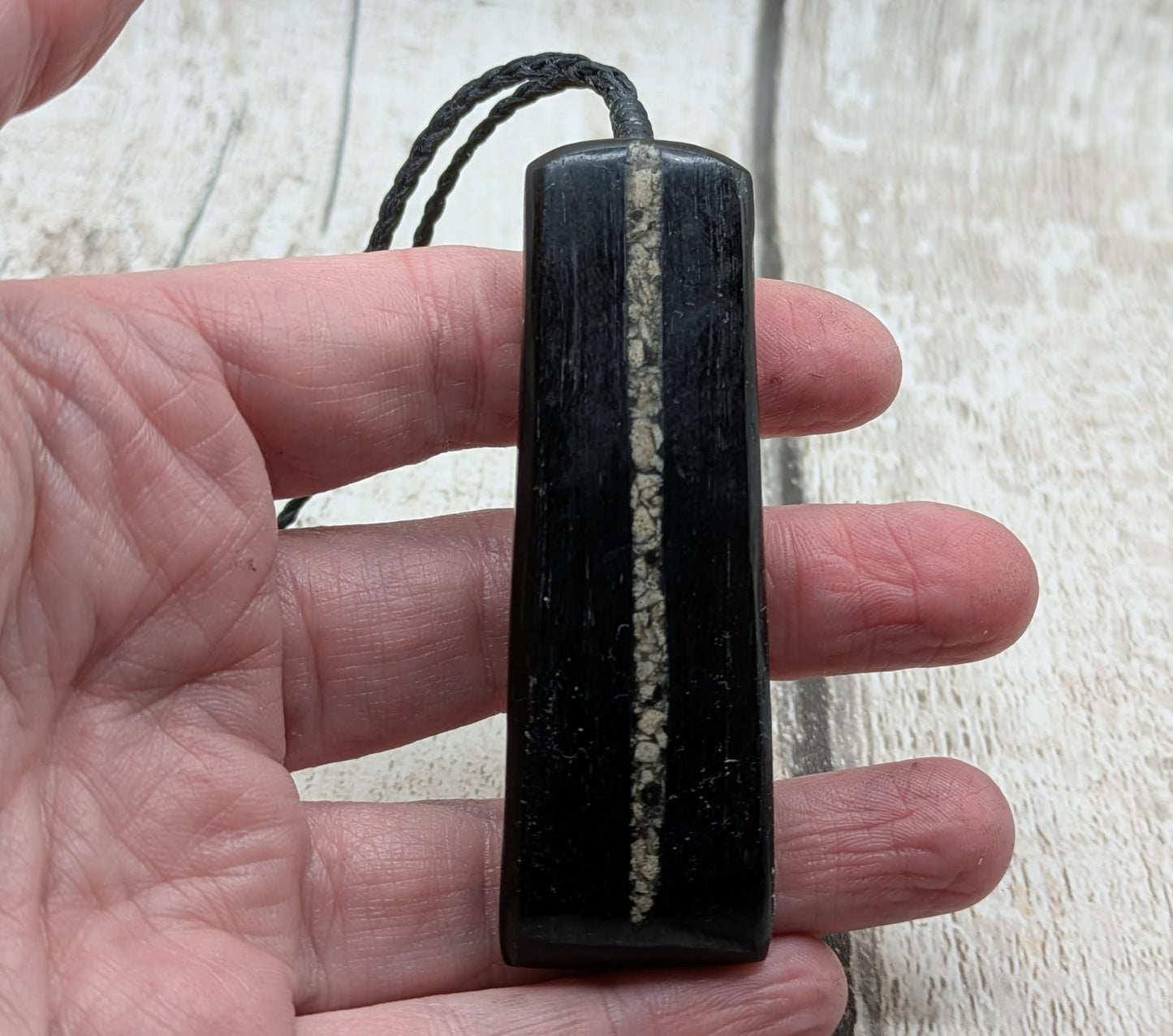Fenland bog oak pendant with Avebury Sarsen inlay.