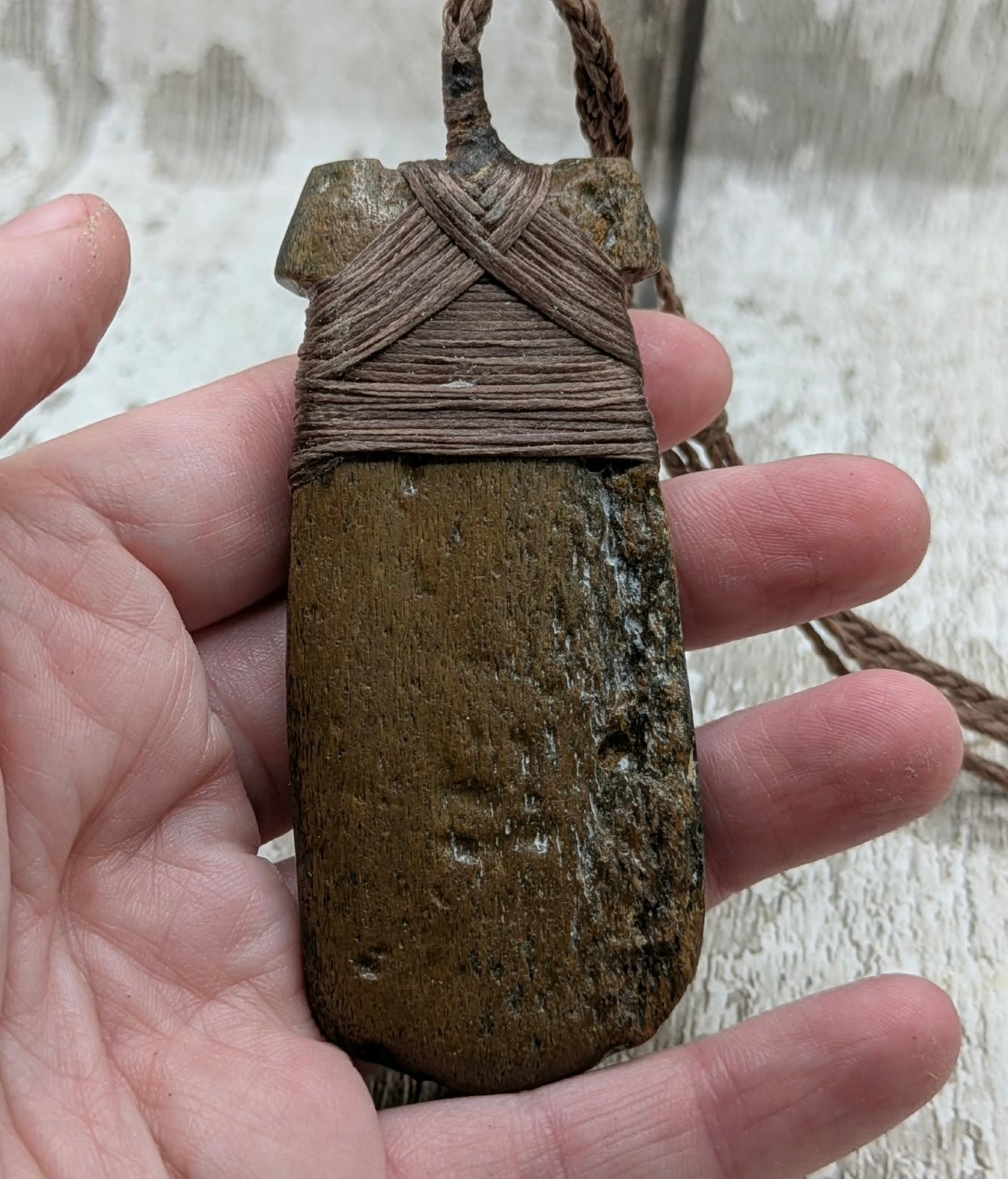 Fossilised whale bone hei toki adze with natural texture.