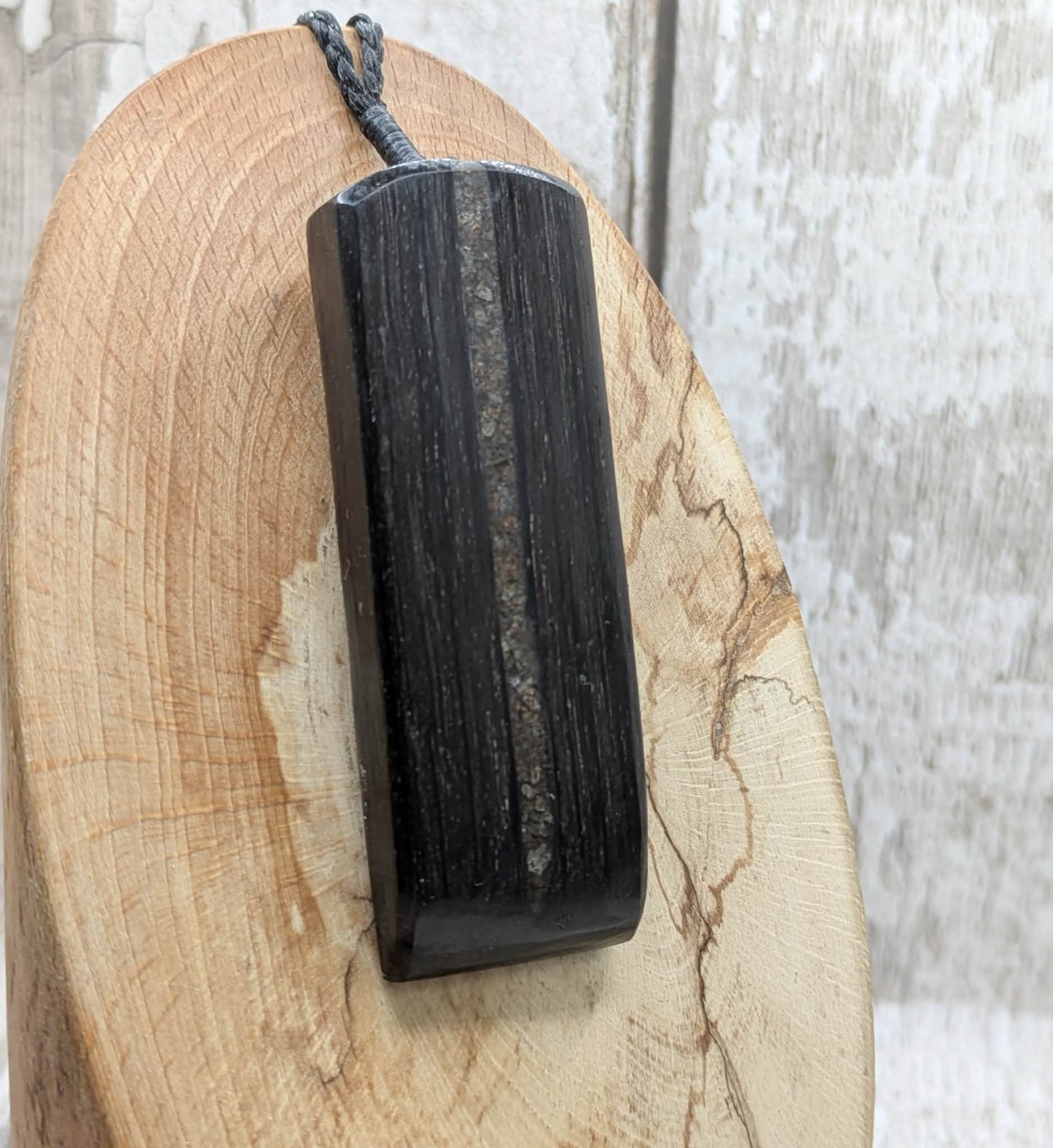 Fenland bog oak with mammoth tooth inlay, Toki adze style pendant.