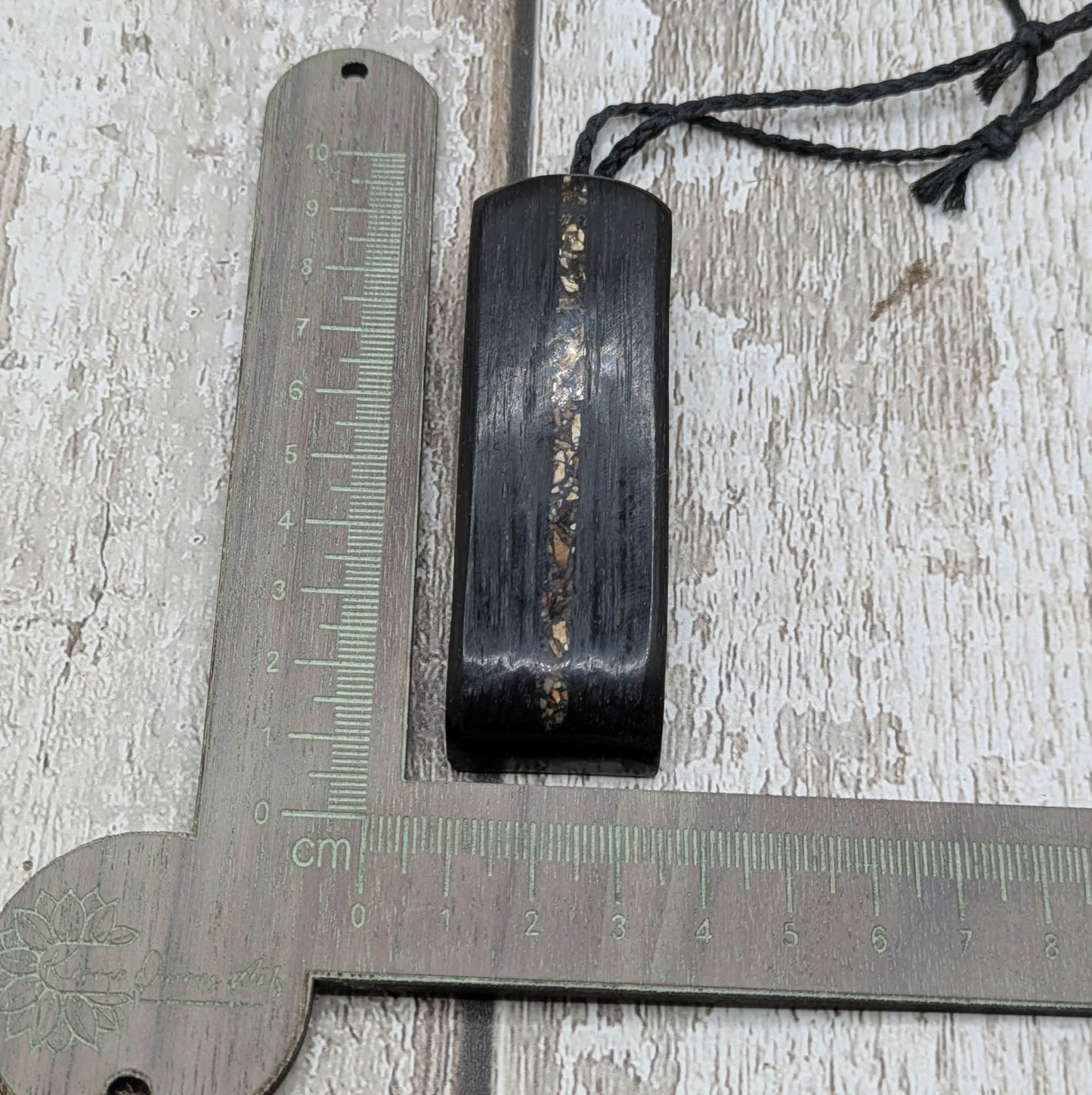 Fenland bog oak and mammoth ivory Toki adze style pendant.