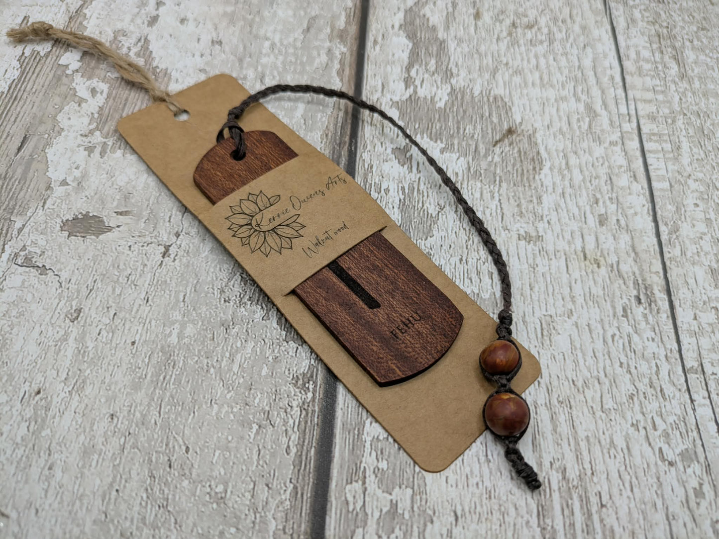 Walnut wood handmade bookmark with fehu Norse rune laser print.
