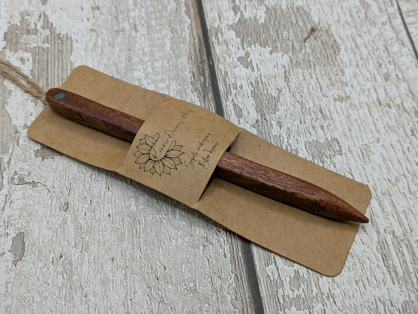 Sepele mahogany wood with blue kyanite inlay.