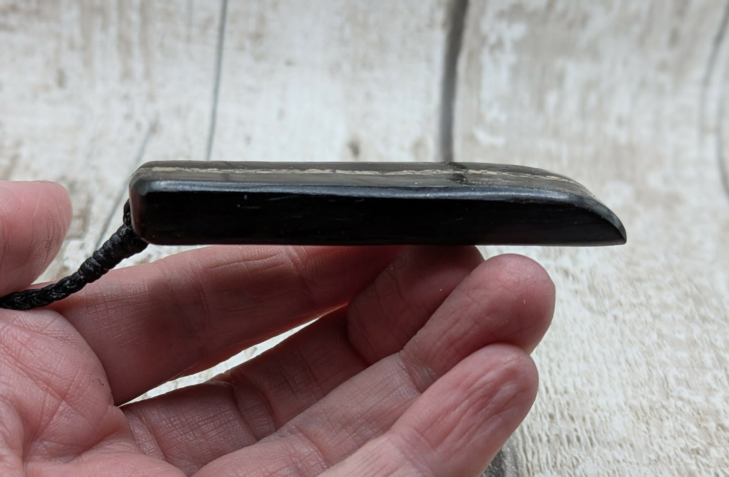 Fenland bog oak pendant with Avebury Sarsen inlay.