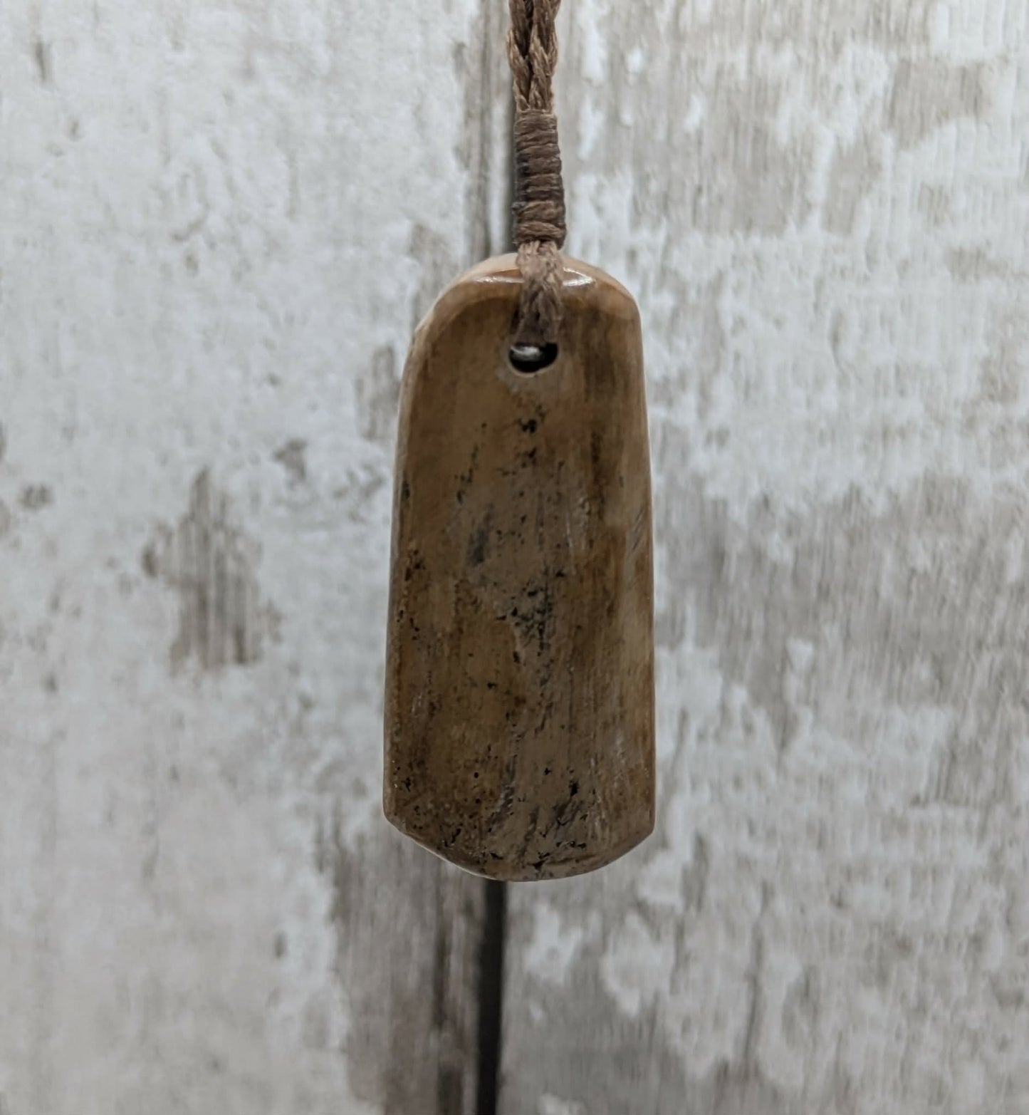 Stable British mammoth ivory trust pendant from Oxfordshire.