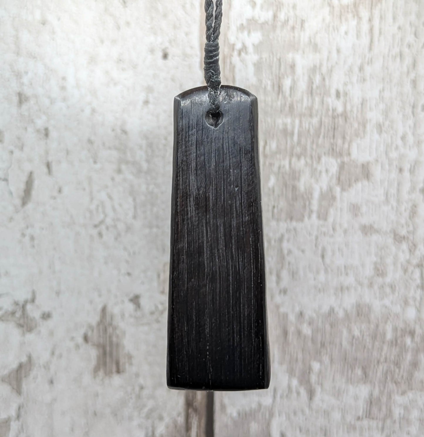 Fenland bog oak pendant with Avebury Sarsen inlay.