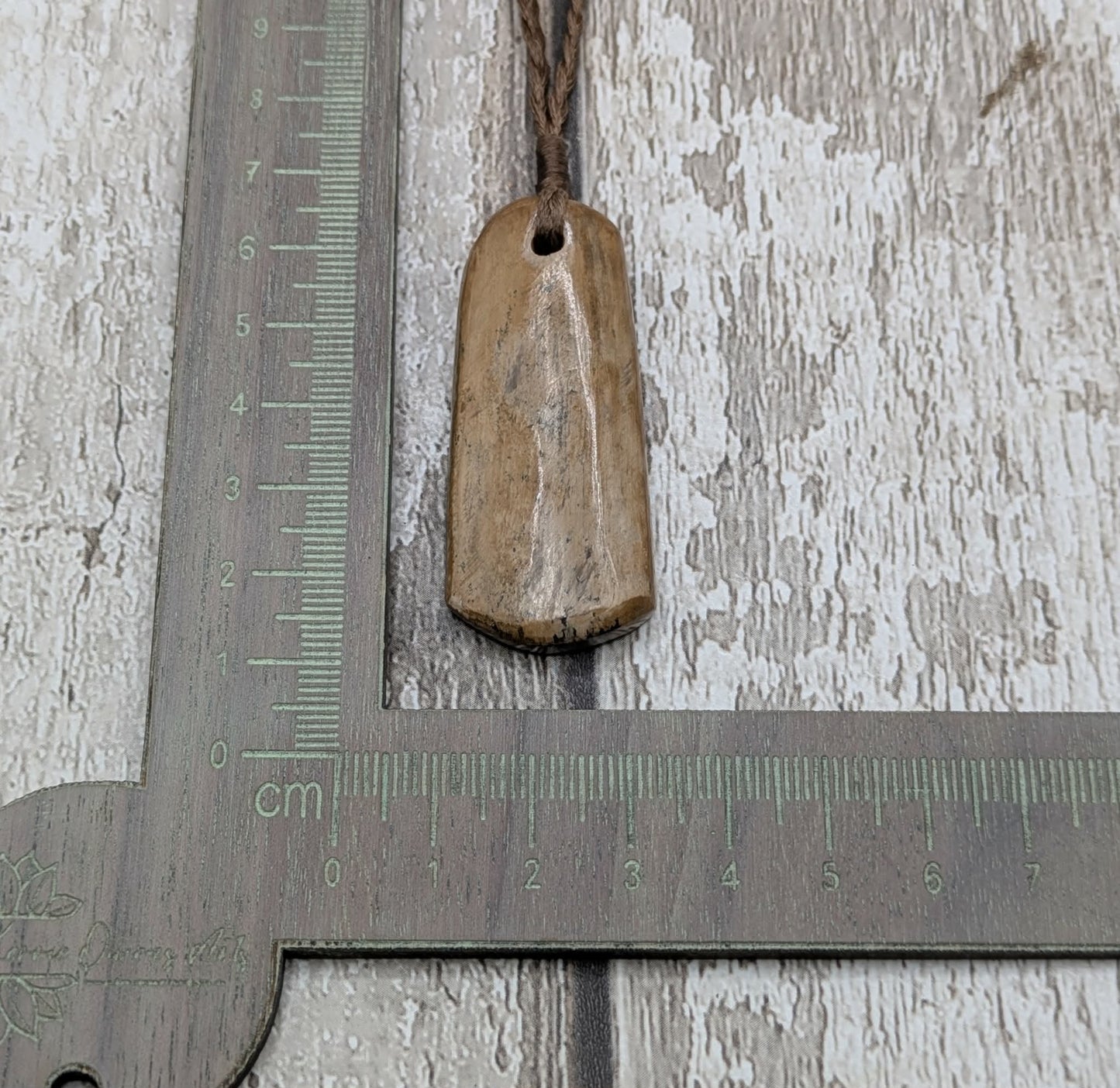 Stable British mammoth ivory trust pendant from Oxfordshire.