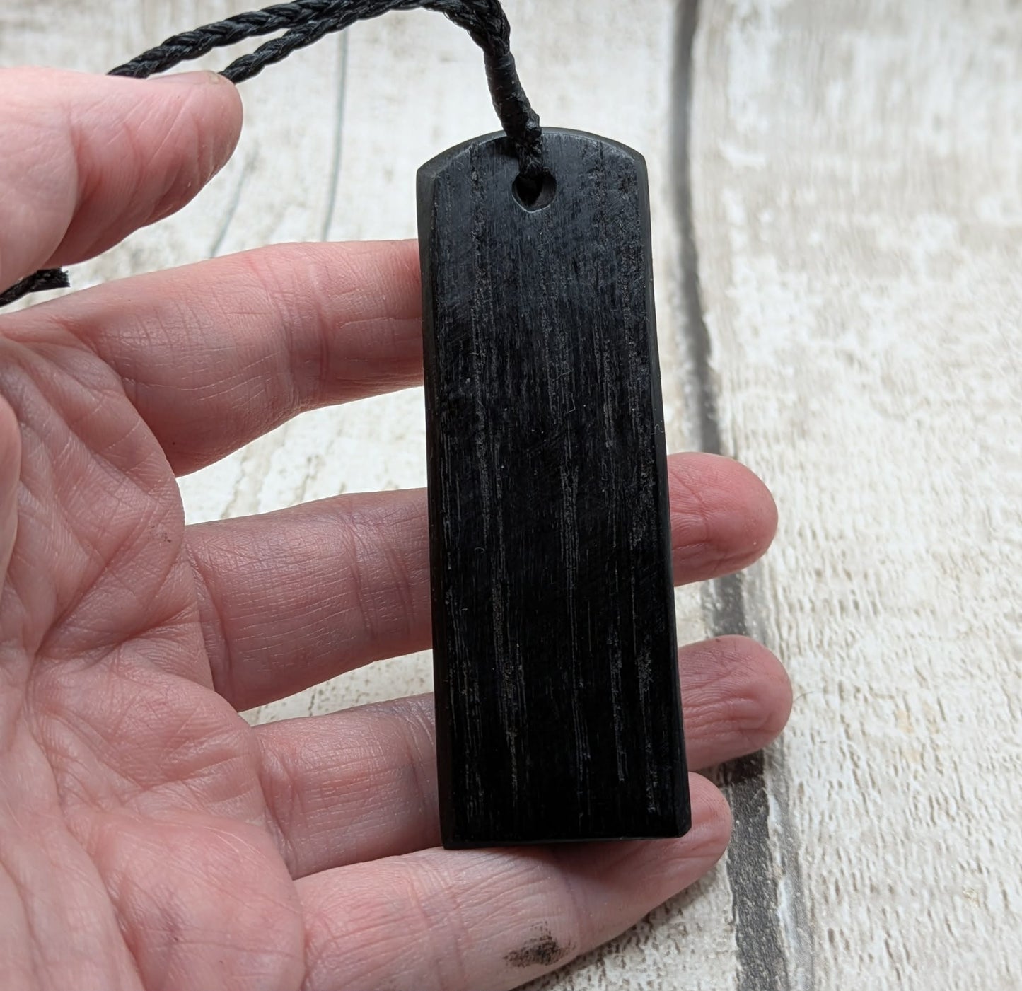 Fenland bog oak and mammoth ivory Toki adze style pendant.
