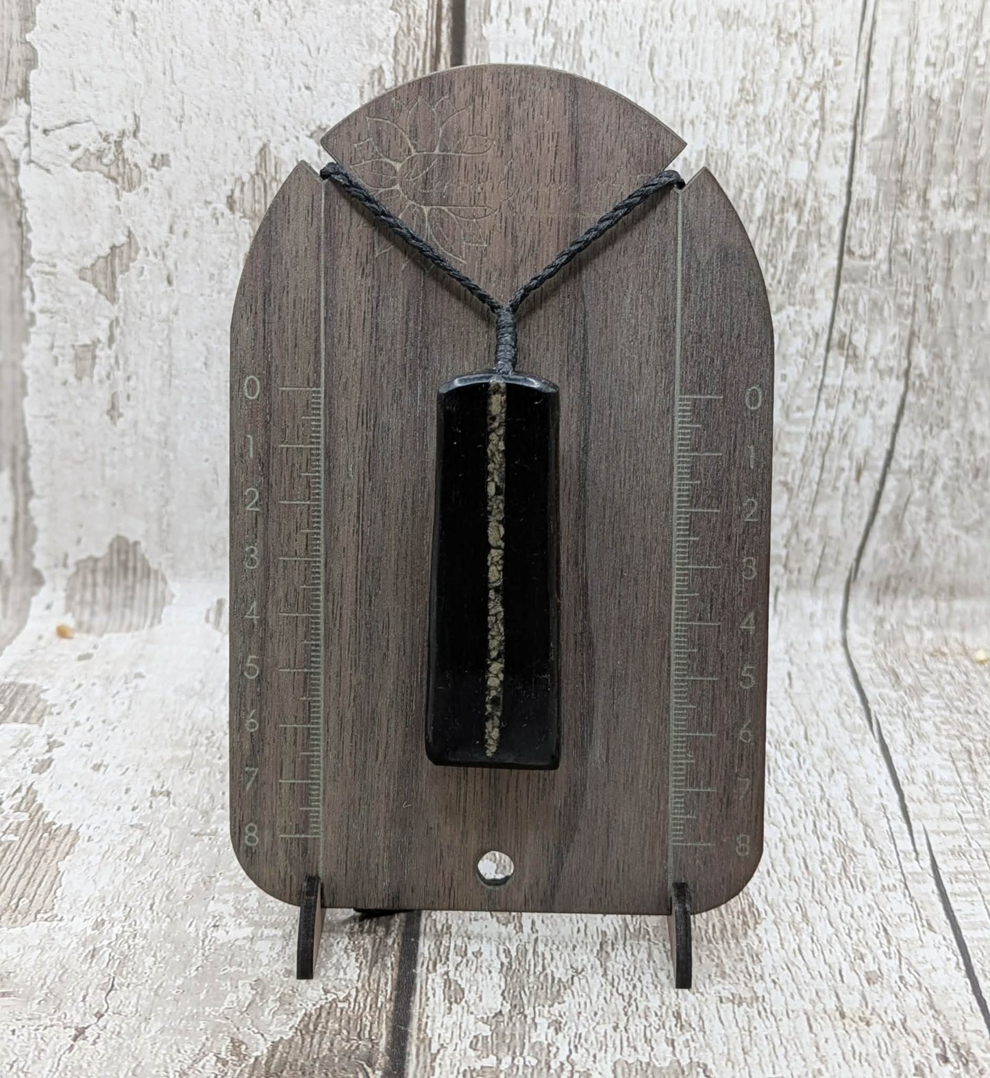 Fenland bog oak pendant with Avebury Sarsen inlay.